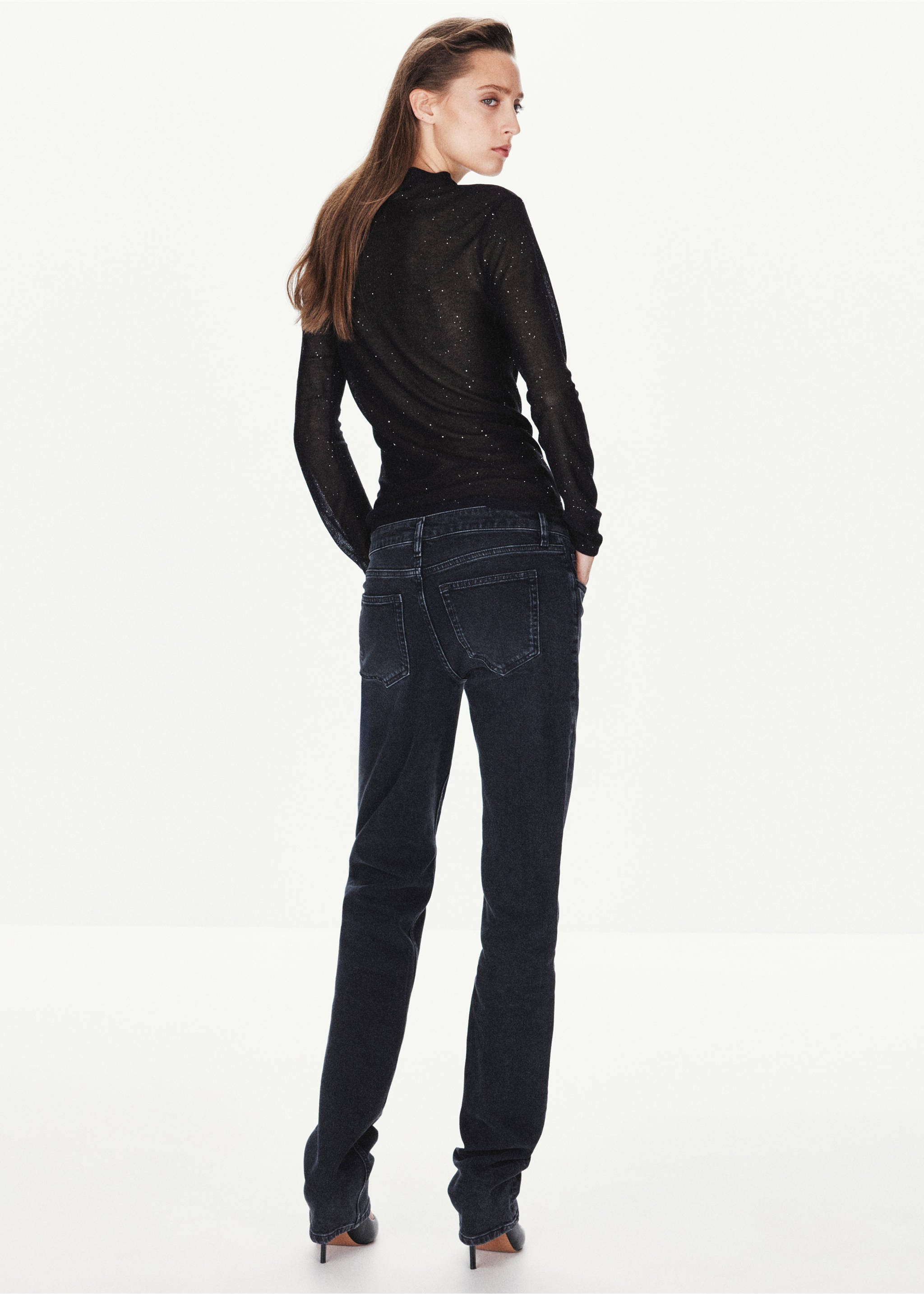 Back view of a sheer black glitter top with long sleeves and high neck., Black. Ref: 37037781-00.