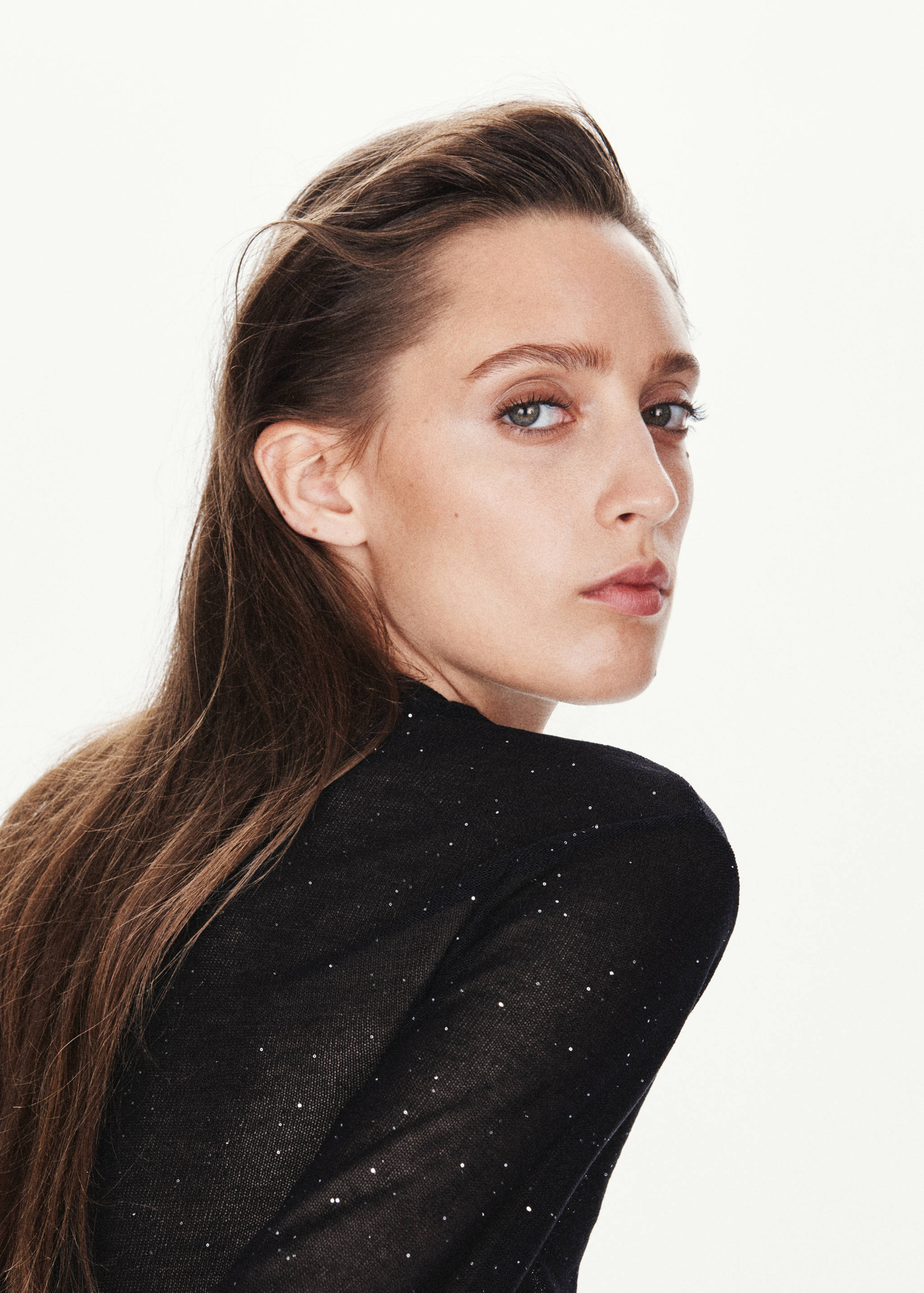 Black sparkly top with a fitted silhouette.