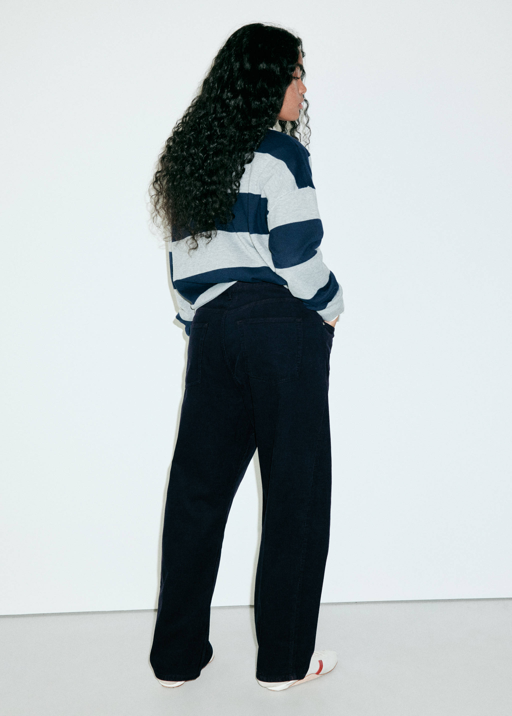 Dark blue straight-leg denim trousers, back view.