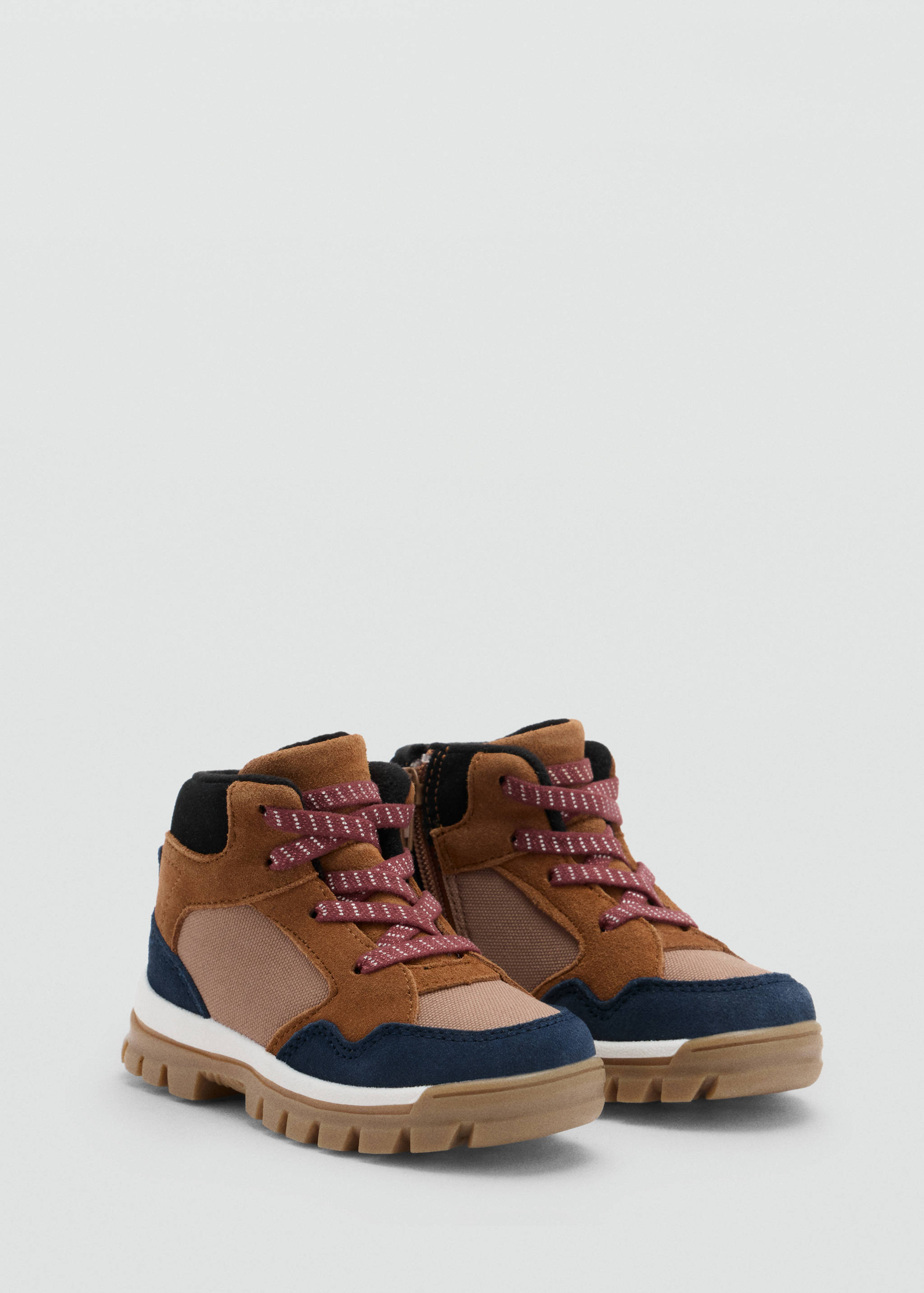 Brown suede children's boots with navy trim and patterned laces.