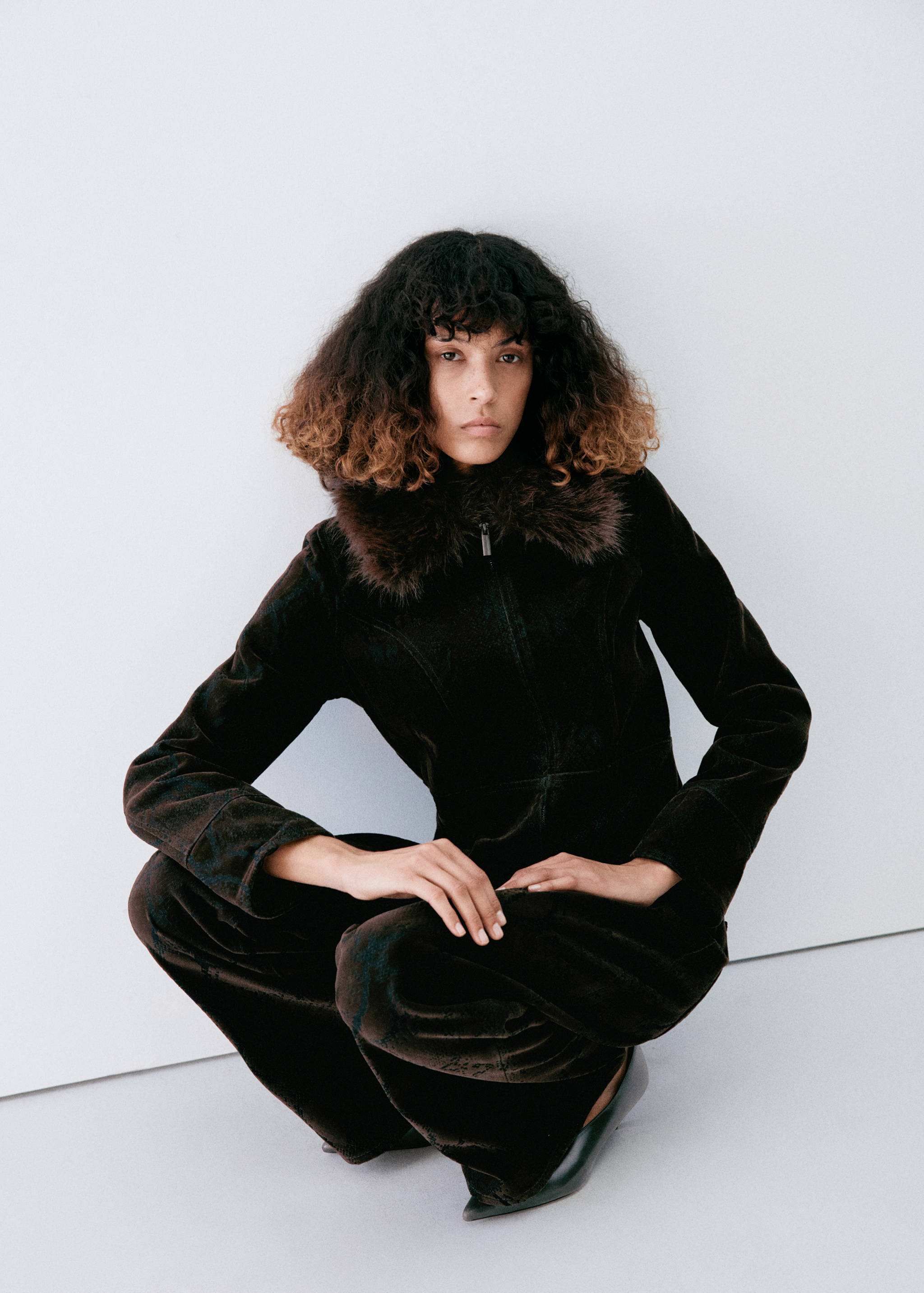 Dark brown velvet jacket with a plush faux-fur collar, shown frontally.