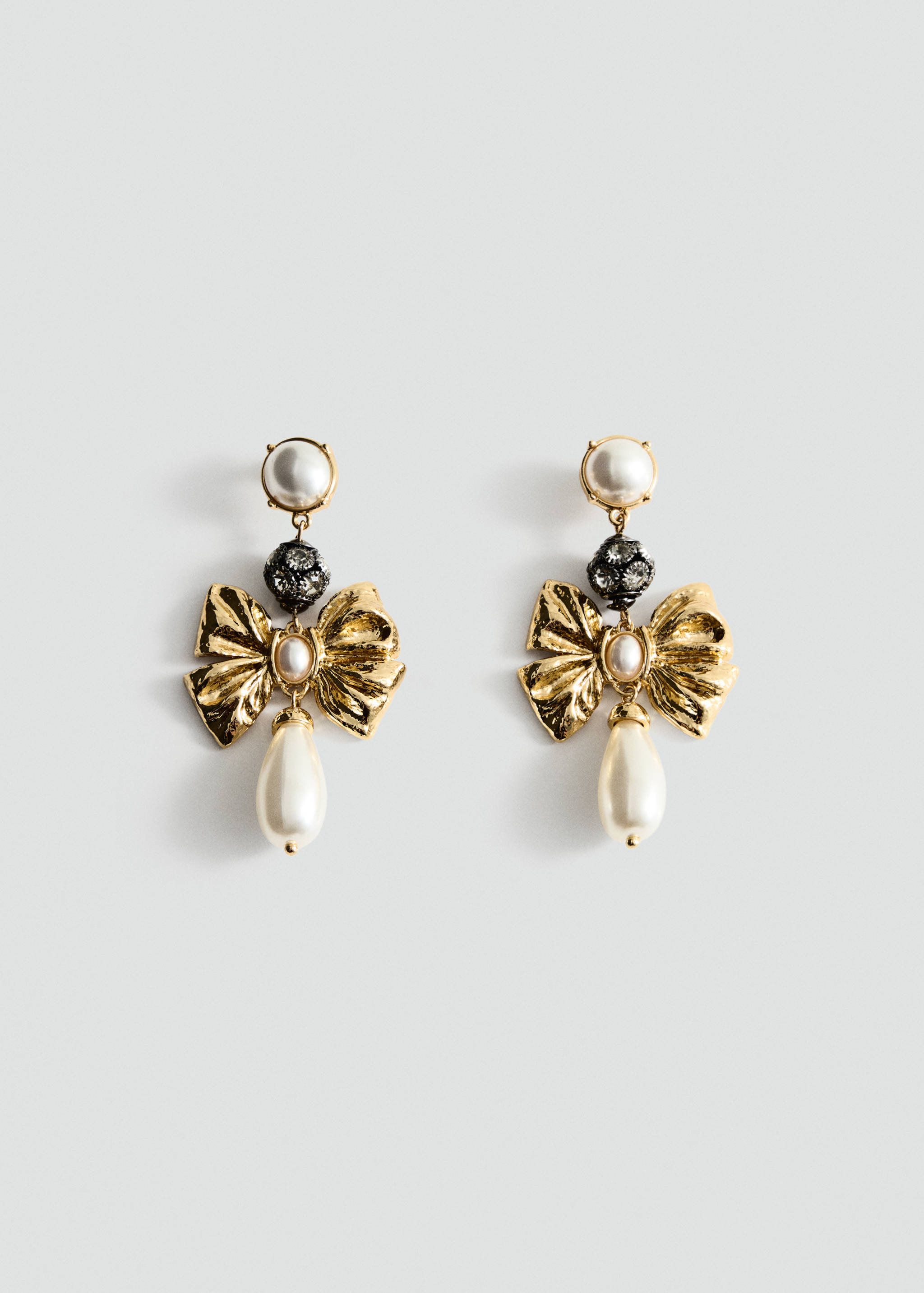 Gold-toned drop earrings featuring faux-pearls, a dark crystal bead, and a metallic bow design.