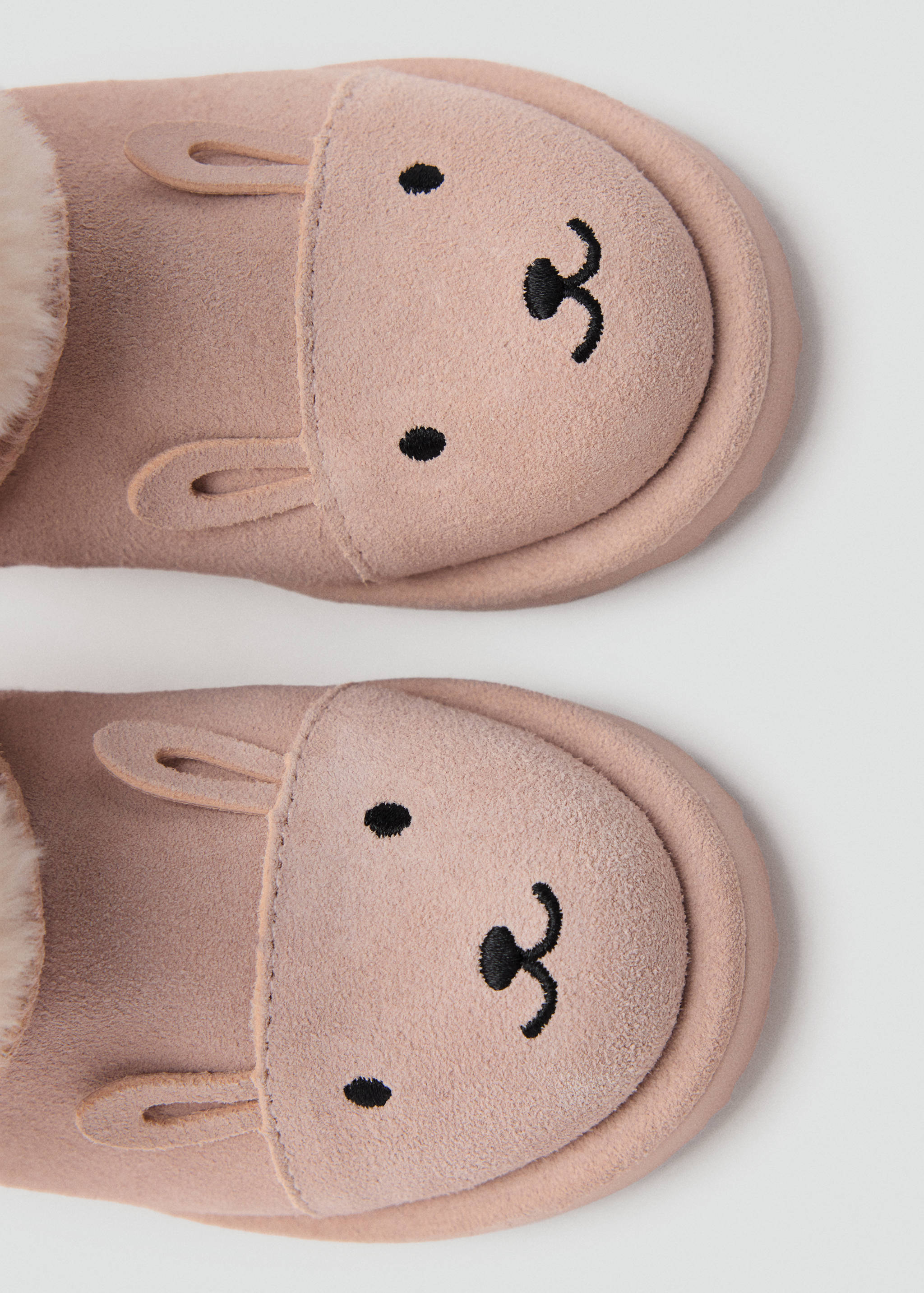 Pink kids' boots with embroidered animal face details.