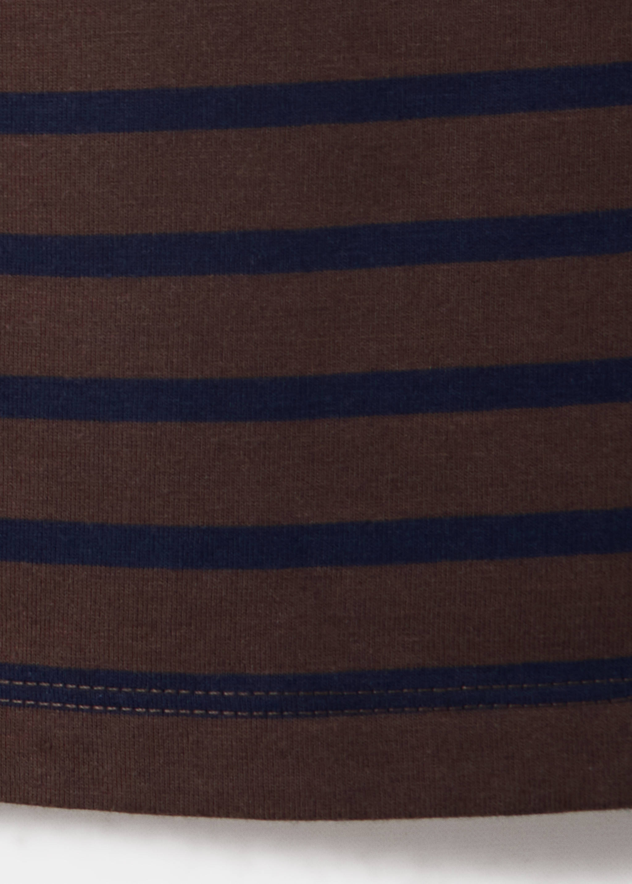 Close-up of a brown and dark blue striped t-shirt fabric