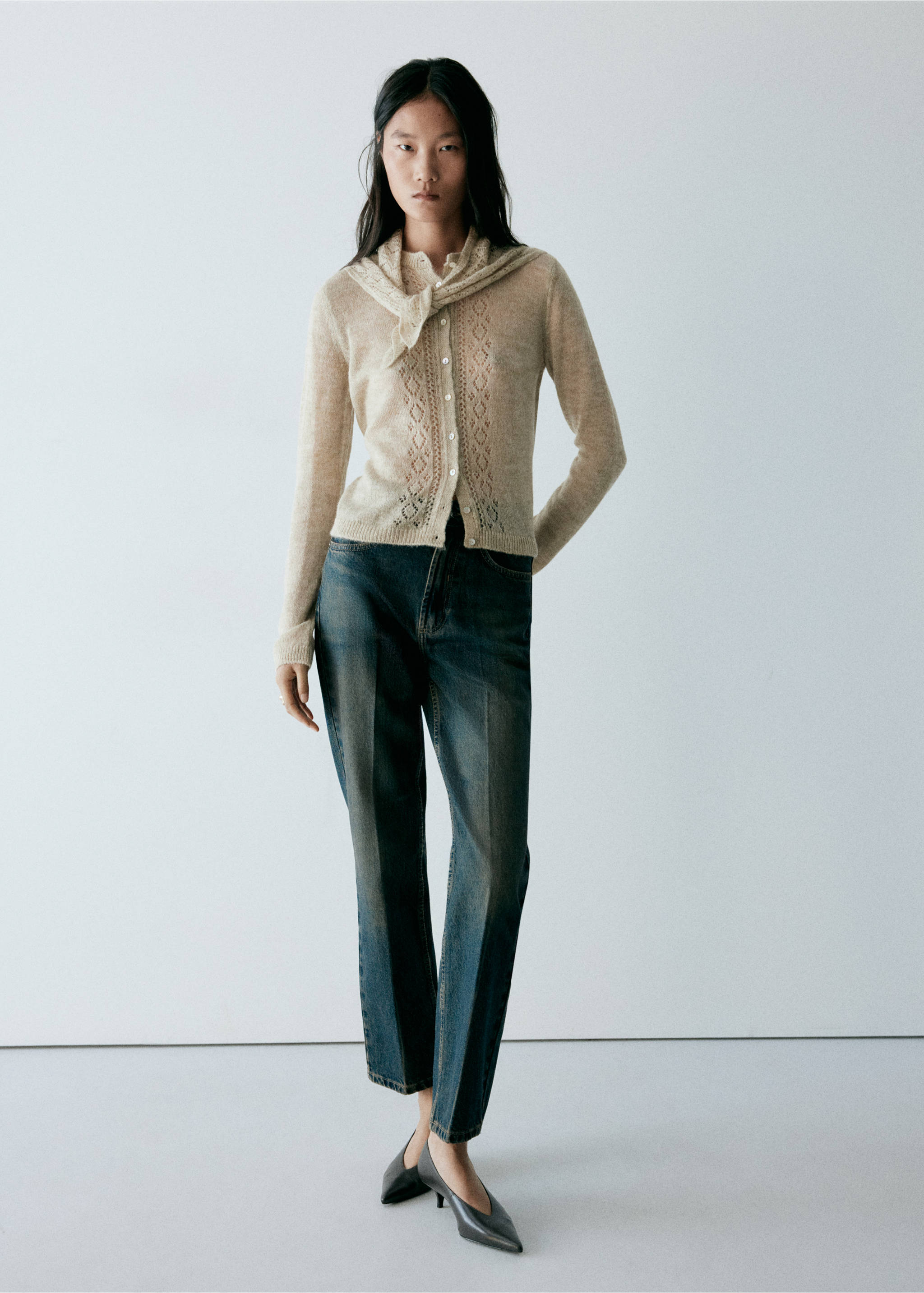 Beige knitted cardigan with openwork details and a matching sweater draped over the shoulders., Pastel Green. Ref: 37037810-01.