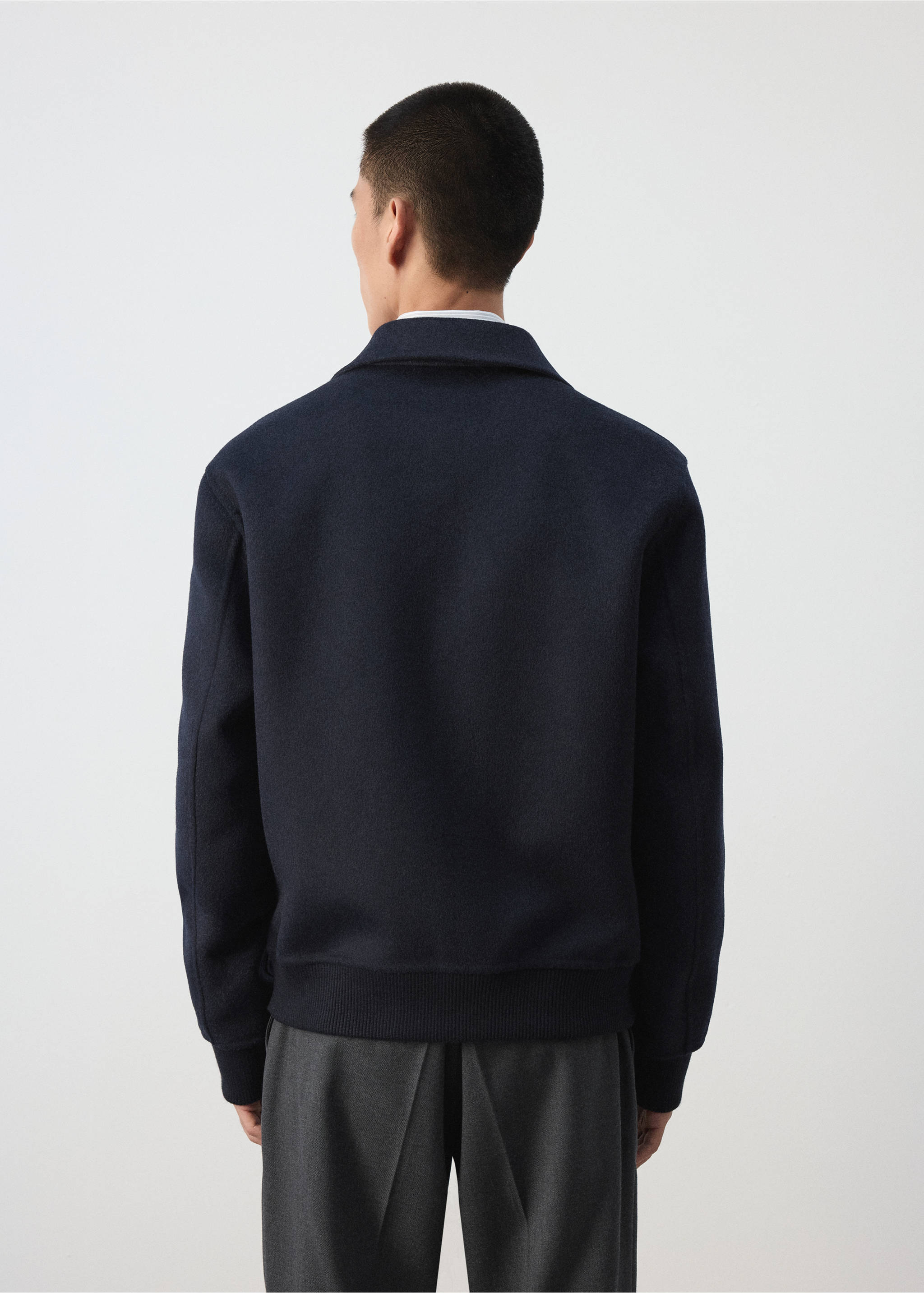 Back view of a dark navy blue jacket with a classic collar and ribbed trim., Night Blue. Ref: 37037885-00.