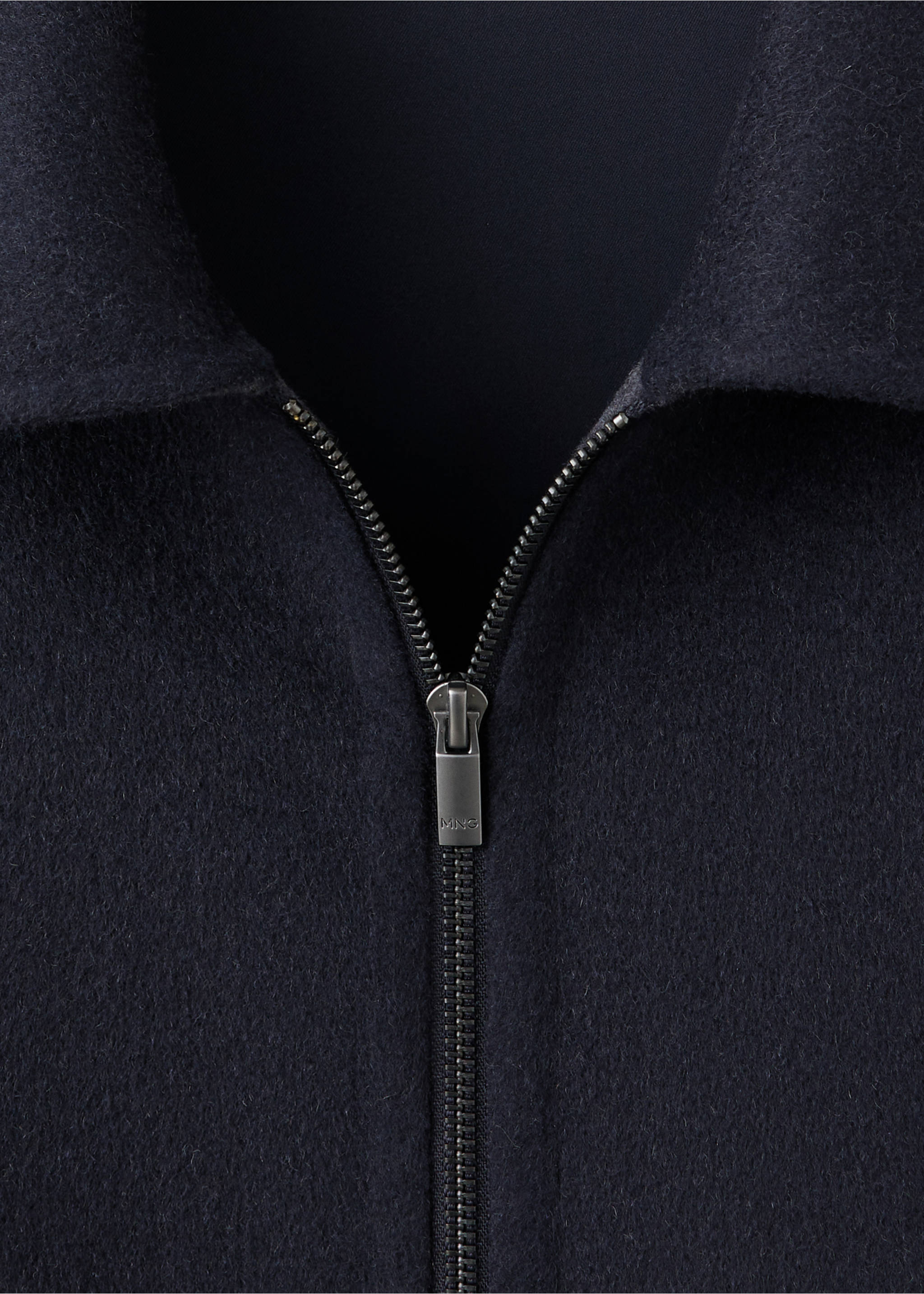 Navy blue jacket close-up, featuring a pointed collar and a silver metal zipper., Night Blue. Ref: 37037885-00.