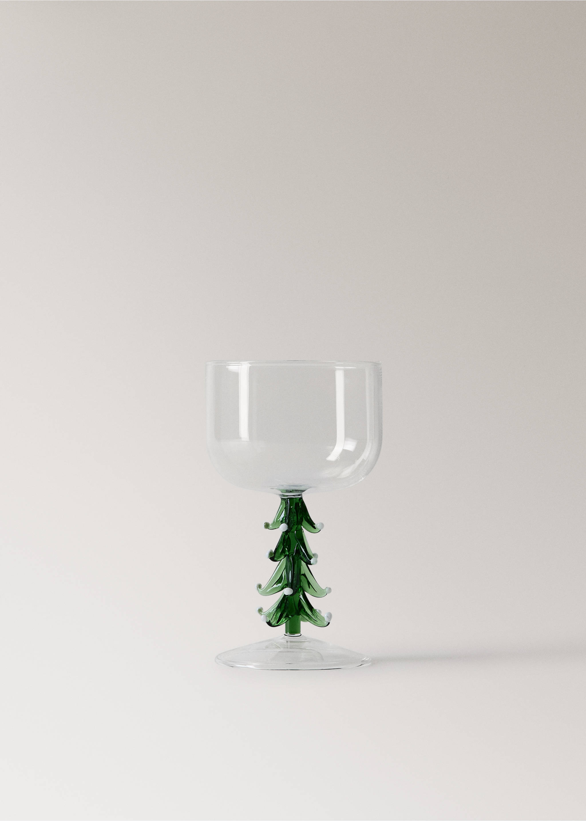 Clear glass goblet with a green tree-shaped stem and white accents., Forest Green. Ref: 37037893-00.