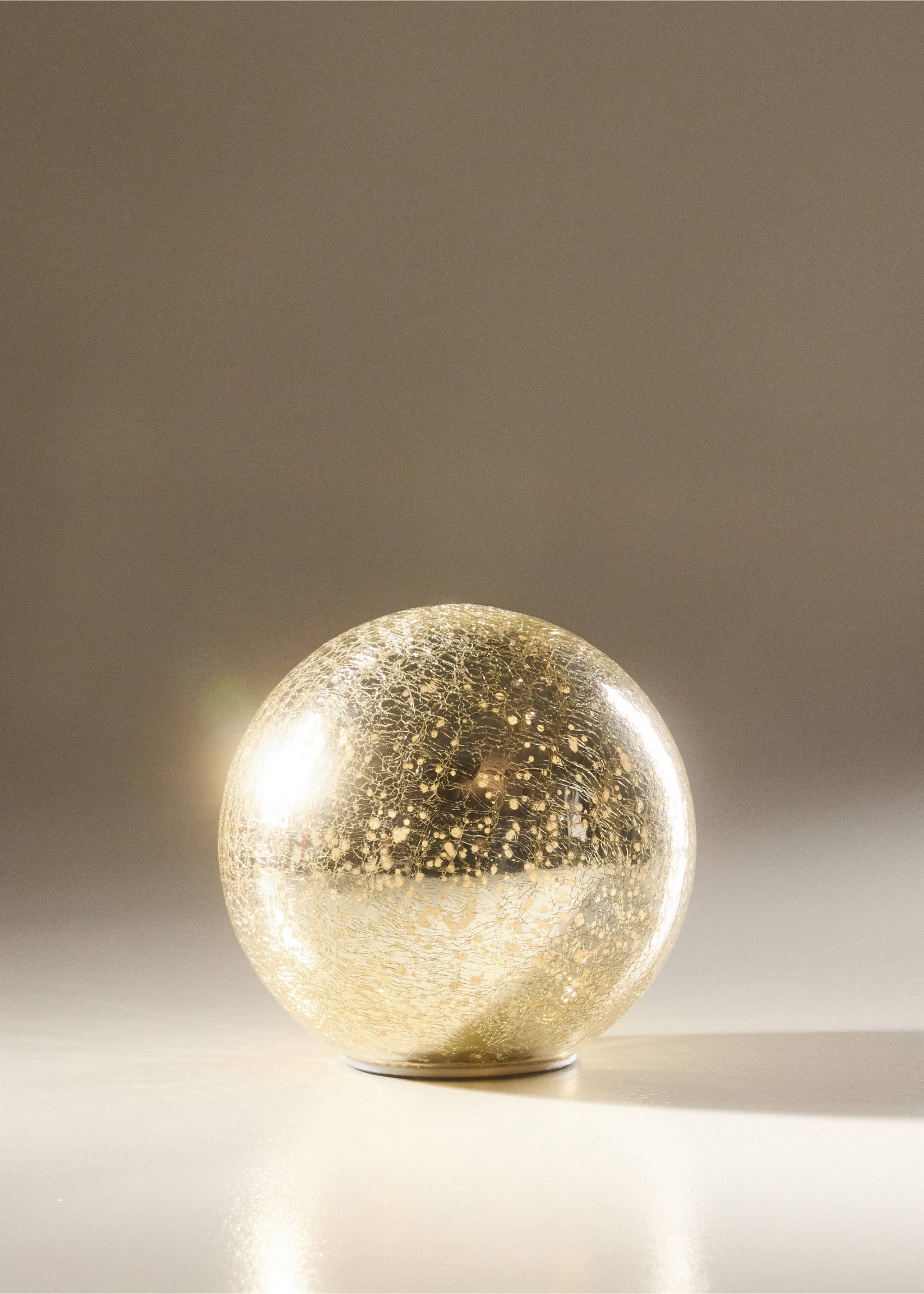 Lit gold cracked-glass spherical Christmas ornament., Gold. Ref: 37037895-00.
