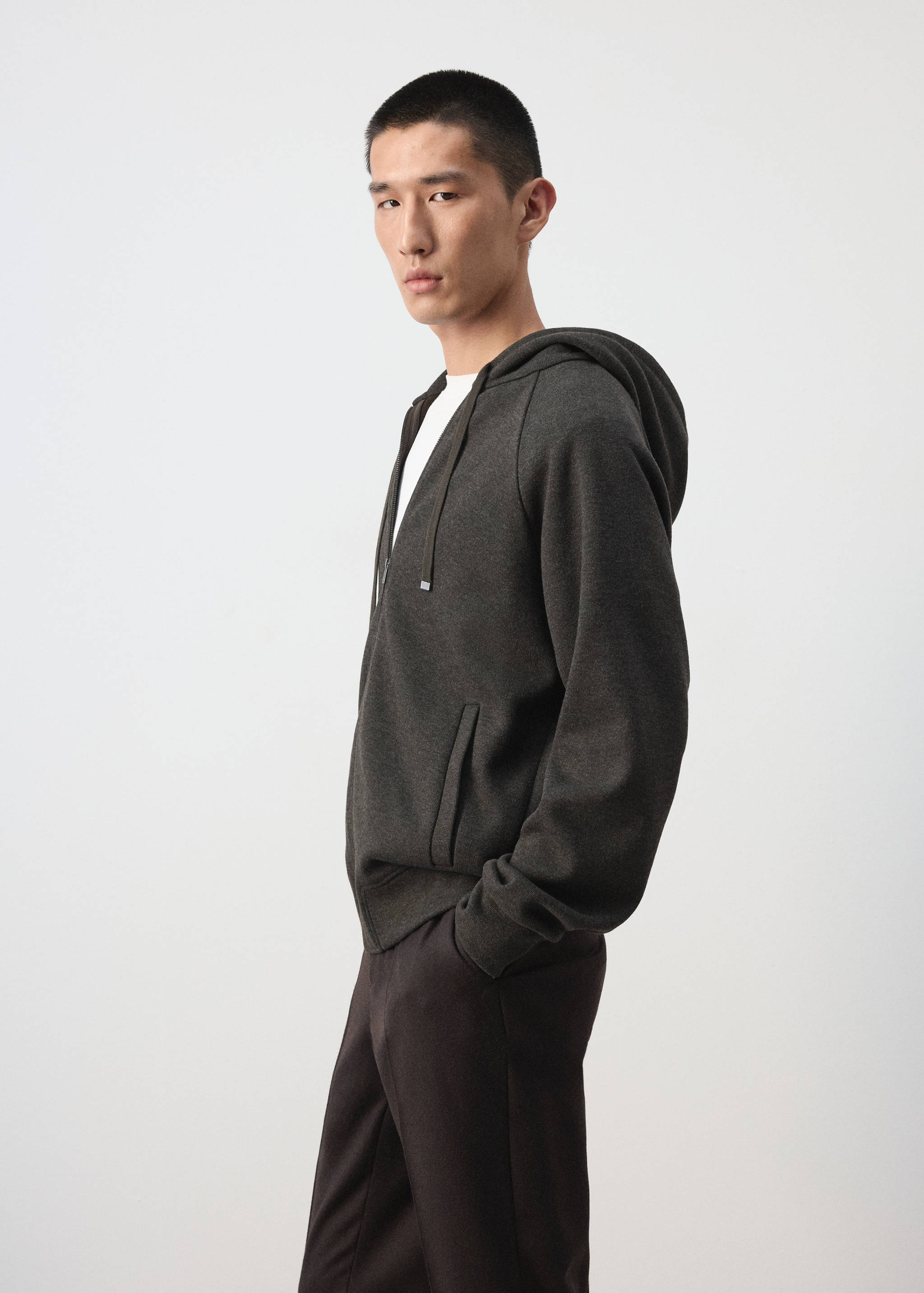 Dark grey zip-up hoodie with a drawstring hood and front pockets.
