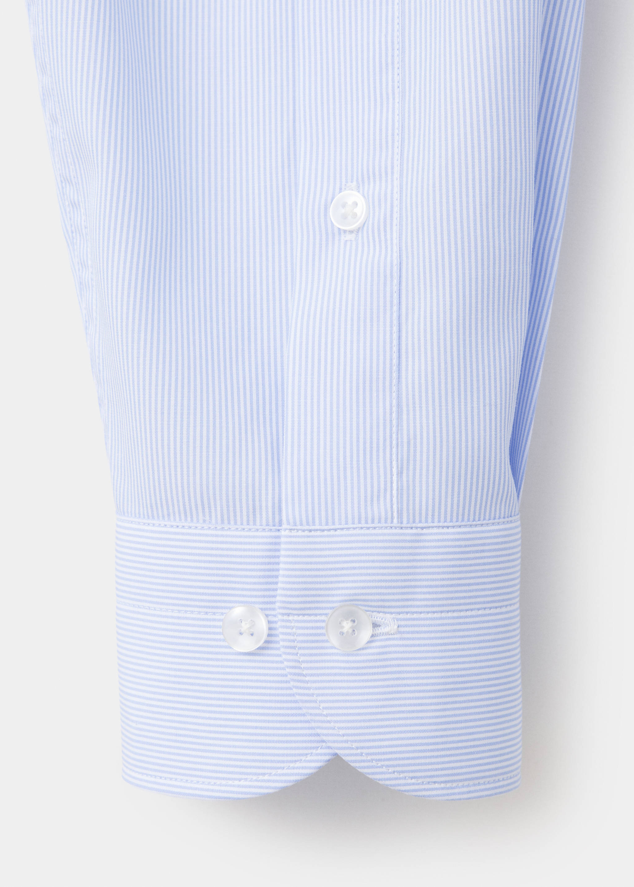 Blue and white striped shirt cuff detail with white buttons.