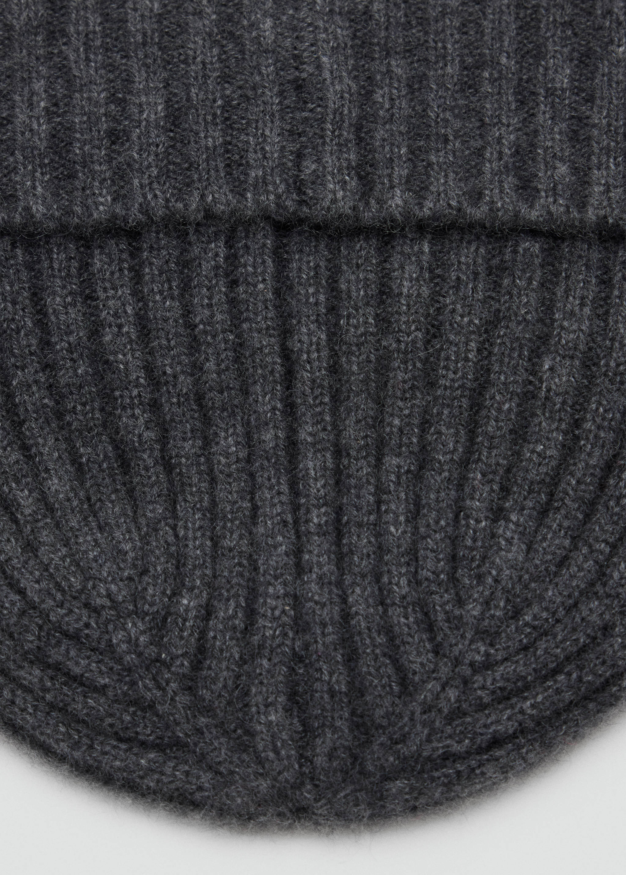 Dark grey ribbed knit beanie, close-up.