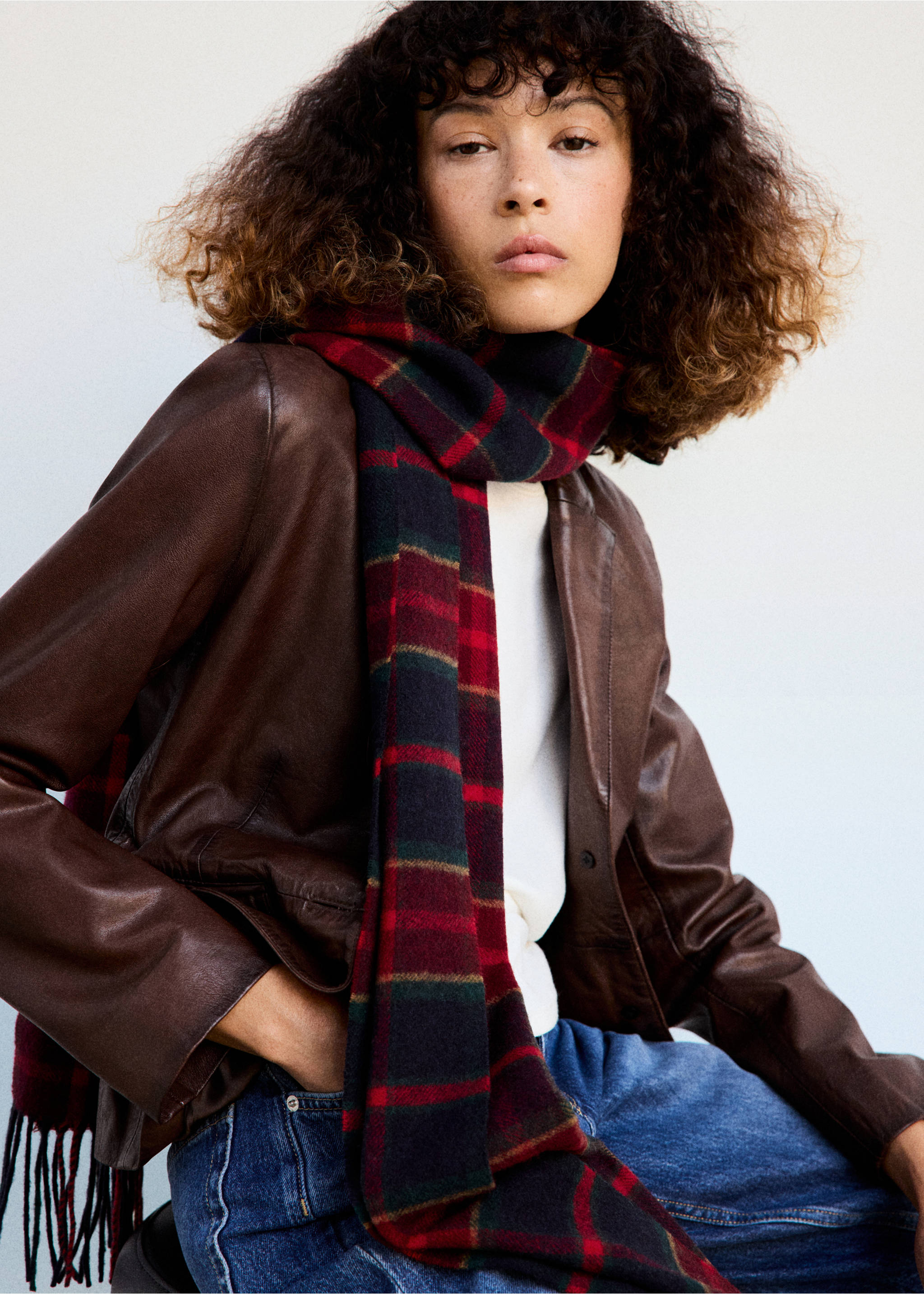 Red and navy tartan check scarf with fringed ends worn by a model., Red. Ref: 37037905-00.