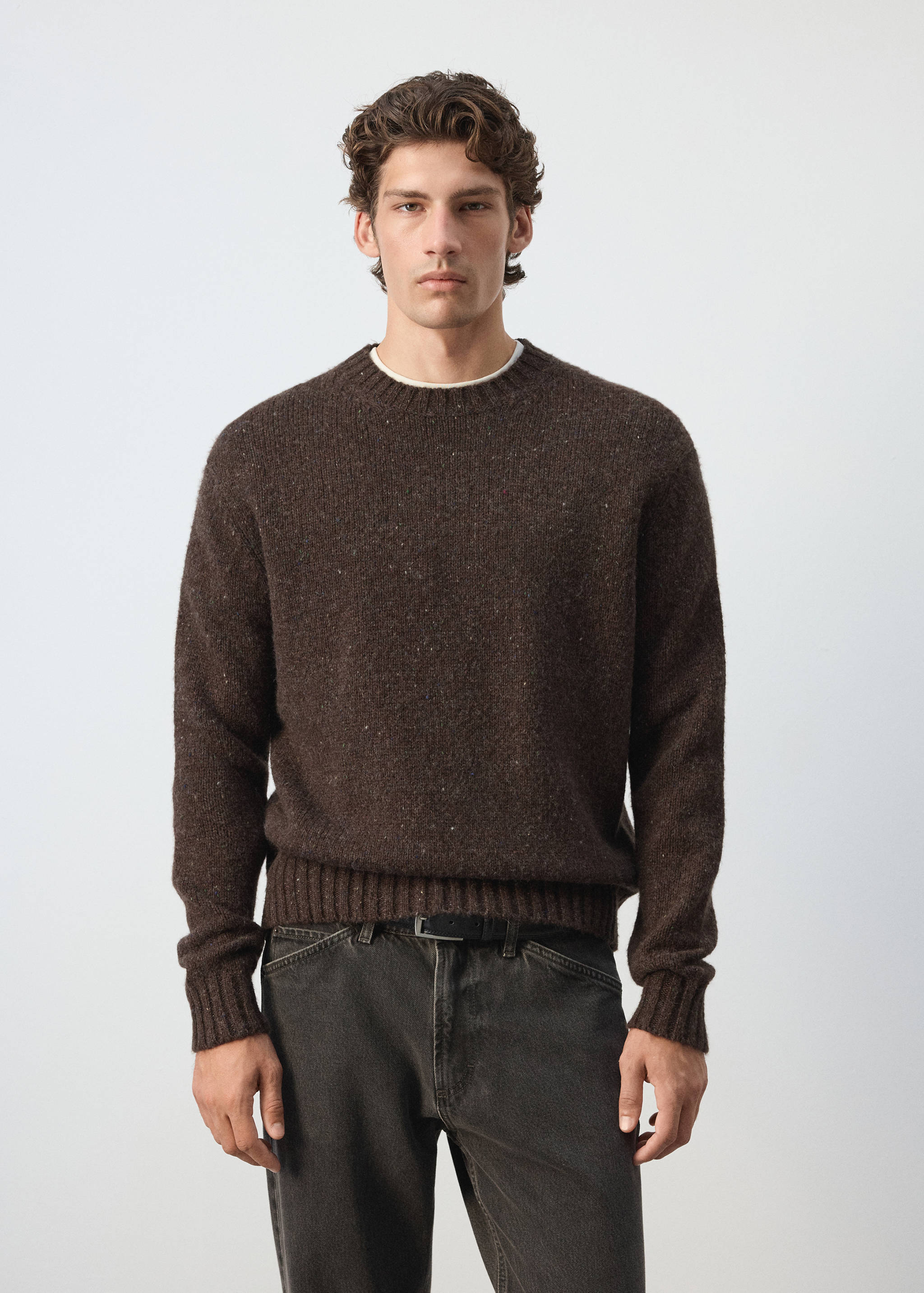 Dark brown melange crew neck sweater in a relaxed fit with ribbed trim.