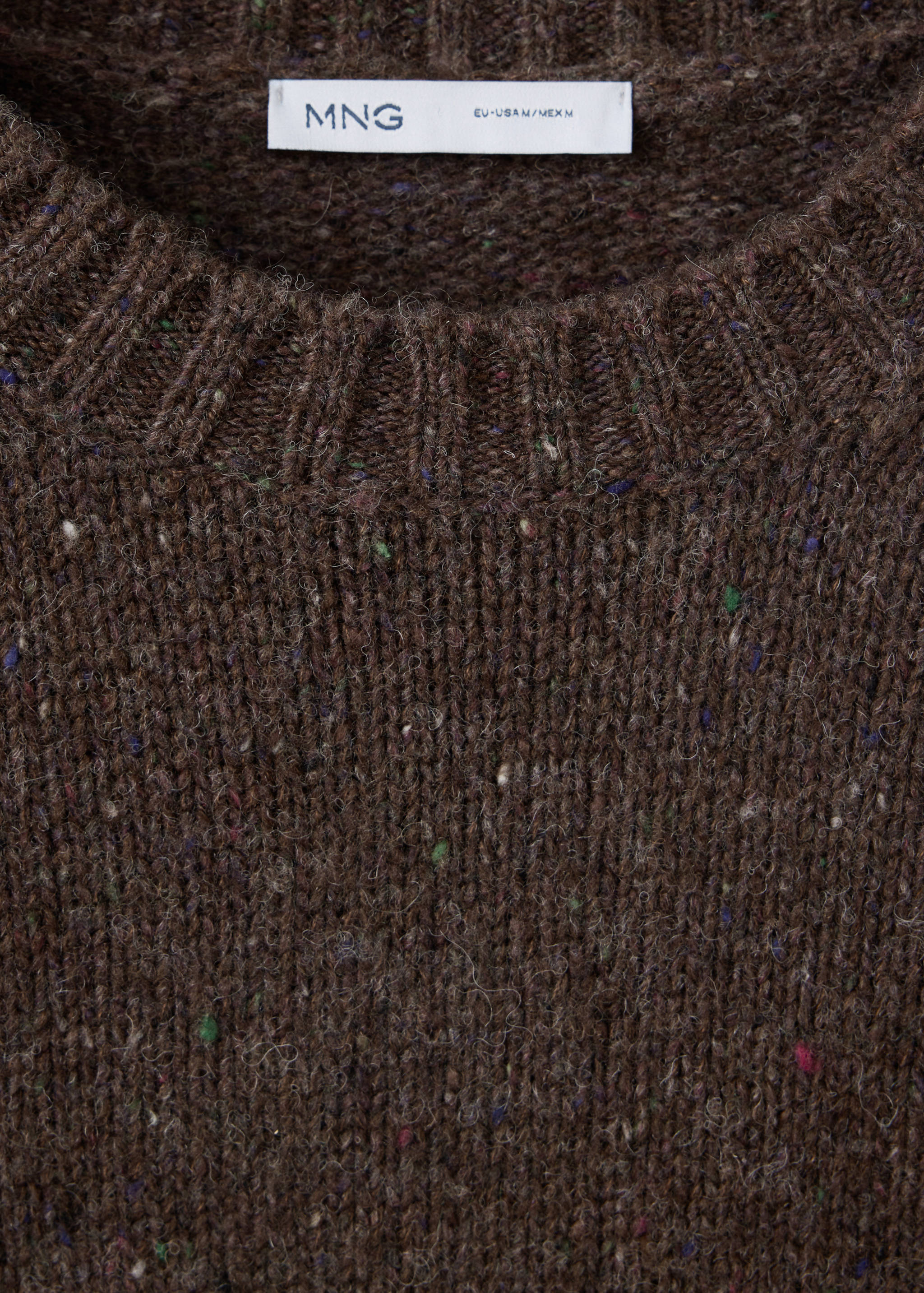 Brown speckled knit jersey sweater featuring a ribbed crew neck.