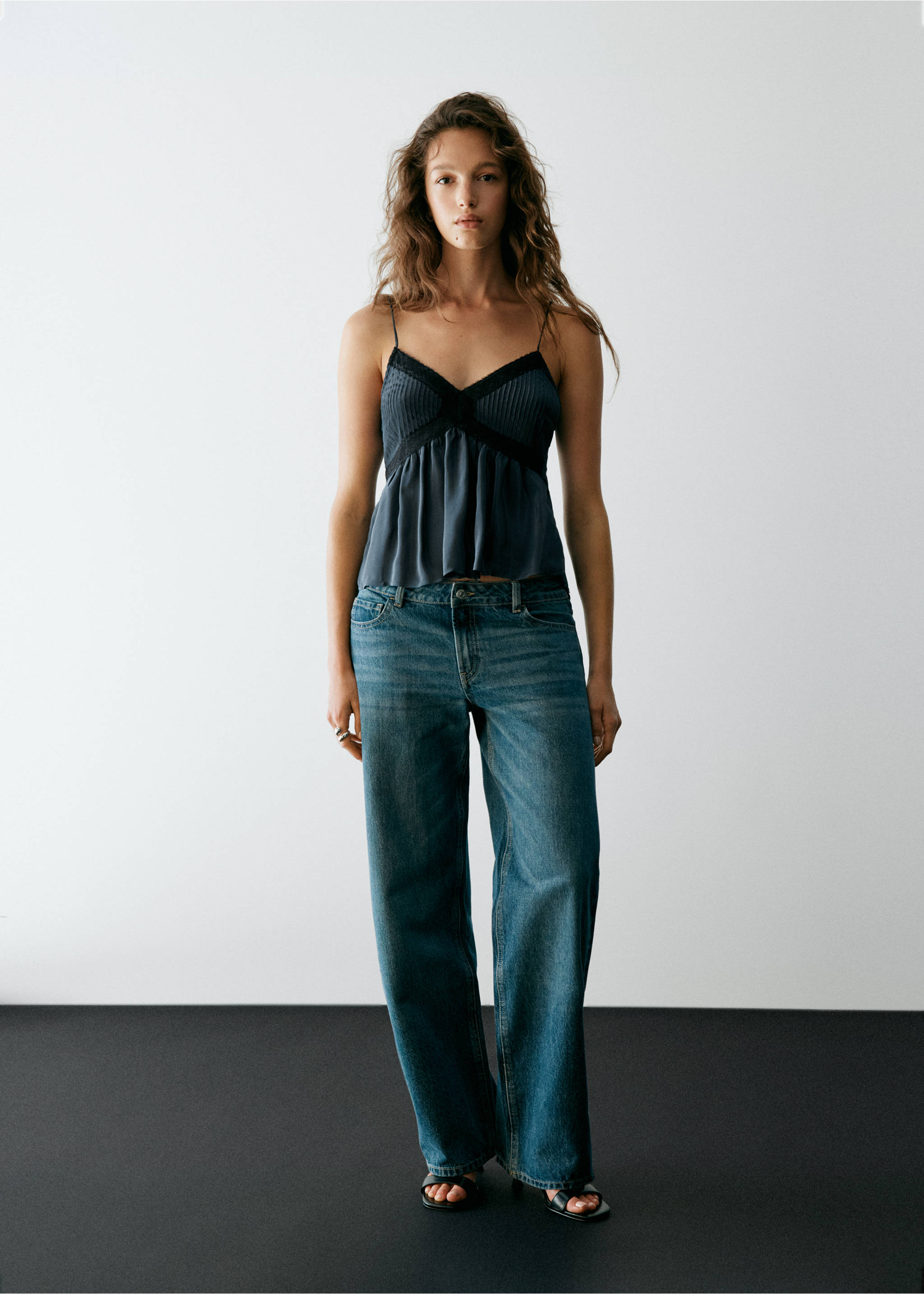Dark blue camisole top with pleated fabric and lace trim, worn with blue denim trousers., Dark Silver. Ref: 37037911-00.
