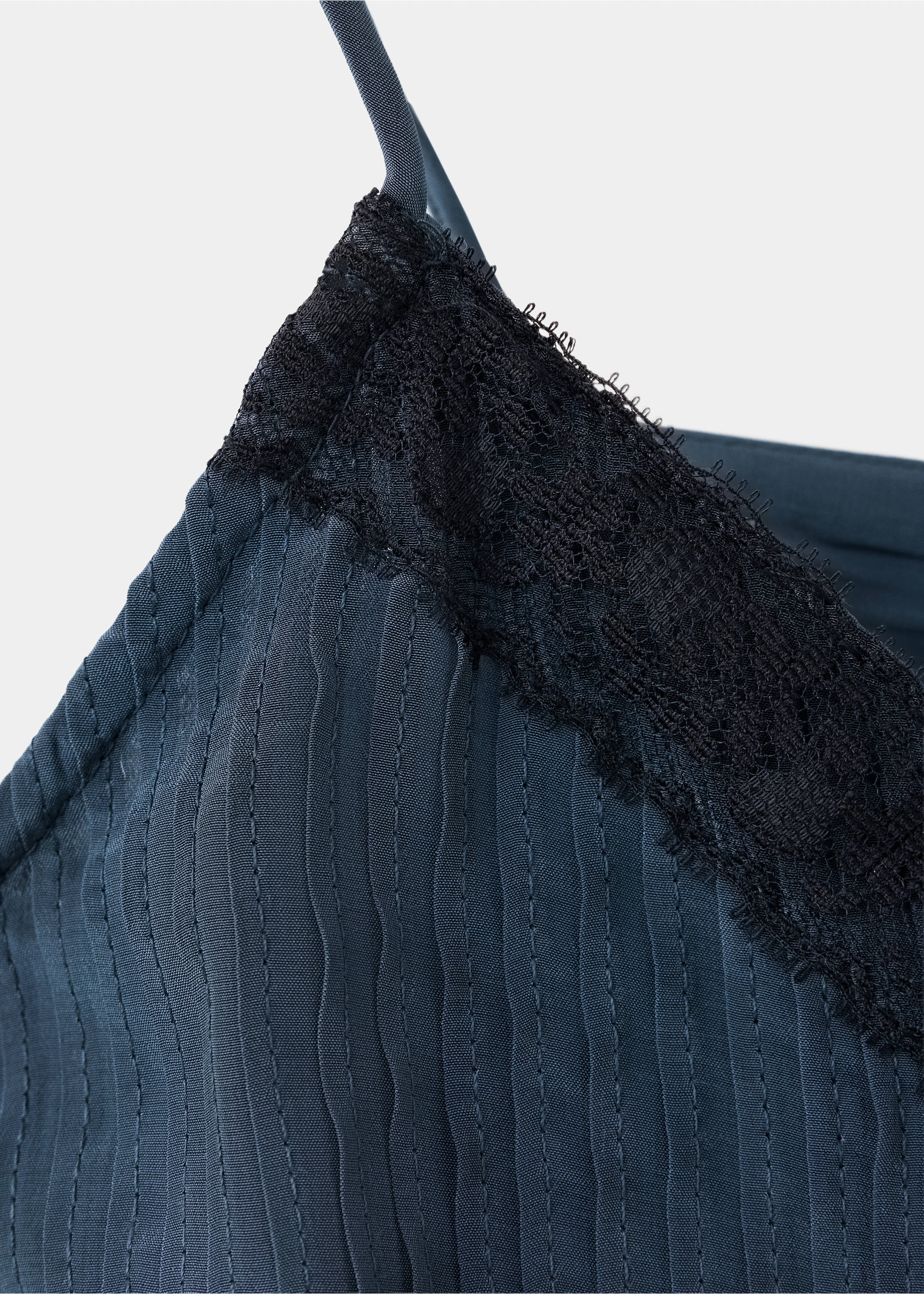Close-up of a dark blue top with thin straps and black lace trim., Dark Silver. Ref: 37037911-00.