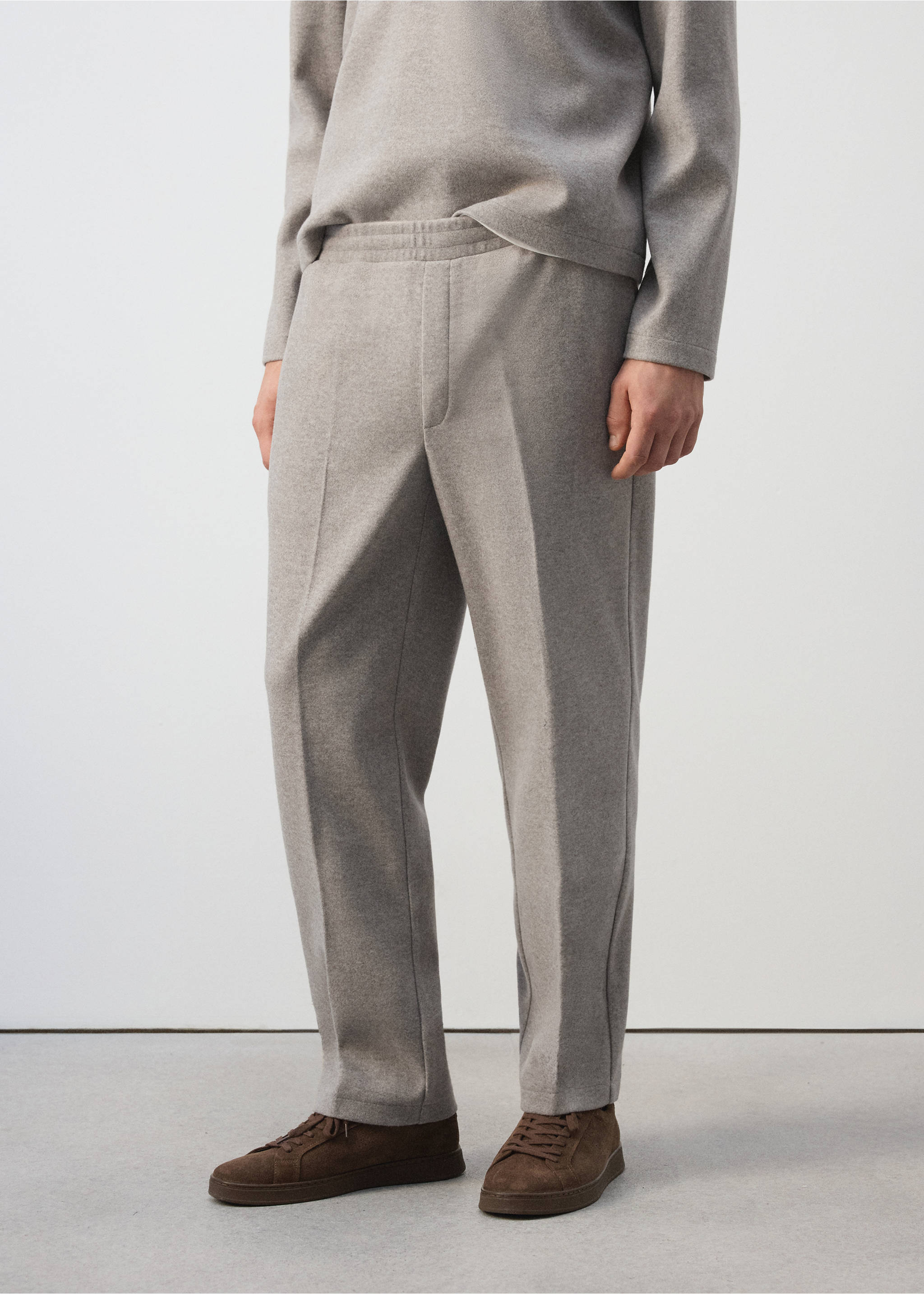 Grey joggers with an elasticated waistband and pressed creases., Light/Pastel Grey. Ref: 37037915-00.