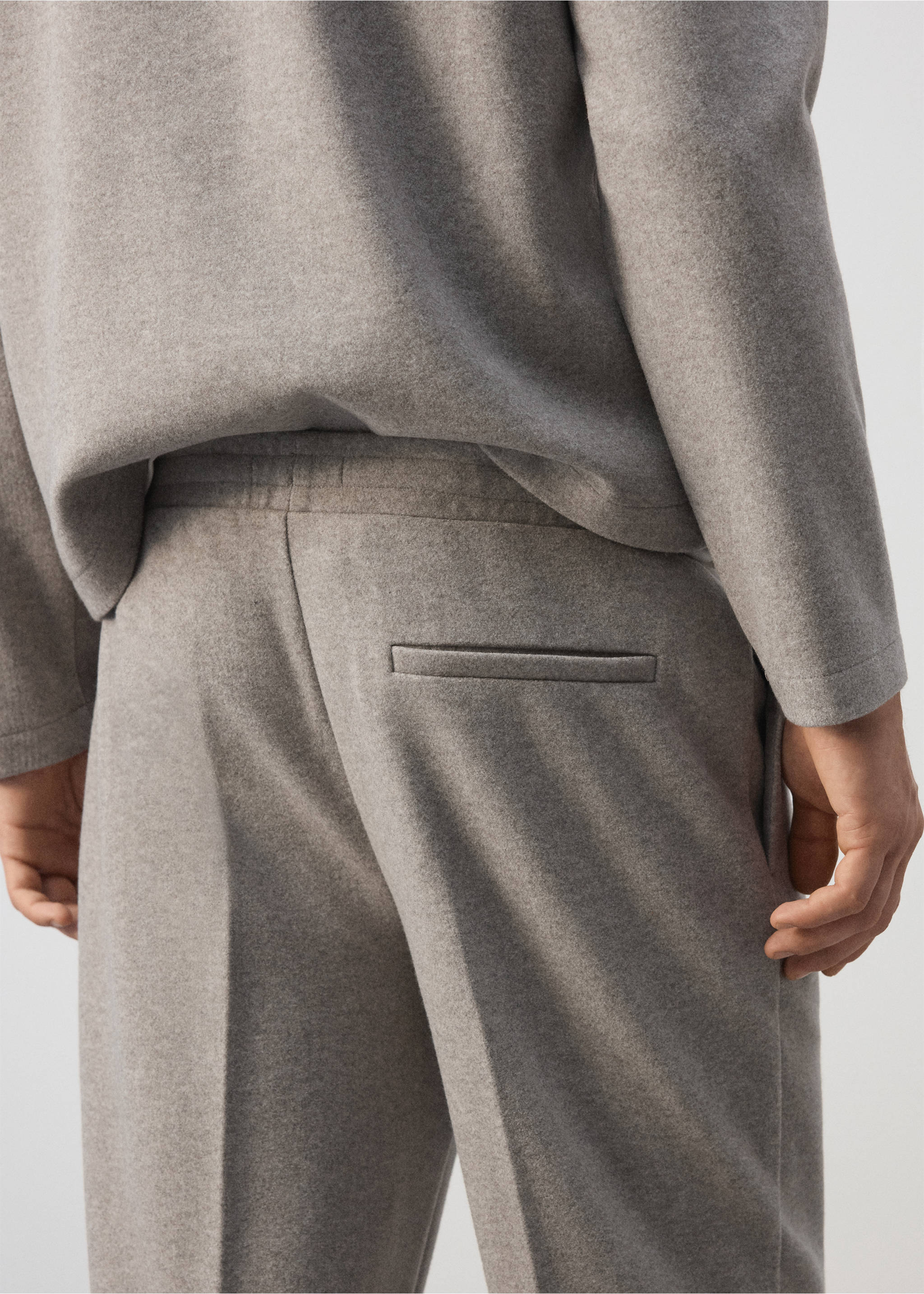 Grey joggers featuring an elasticated waistband and a single rear welt pocket, shown from the back., Light/Pastel Grey. Ref: 37037915-00.