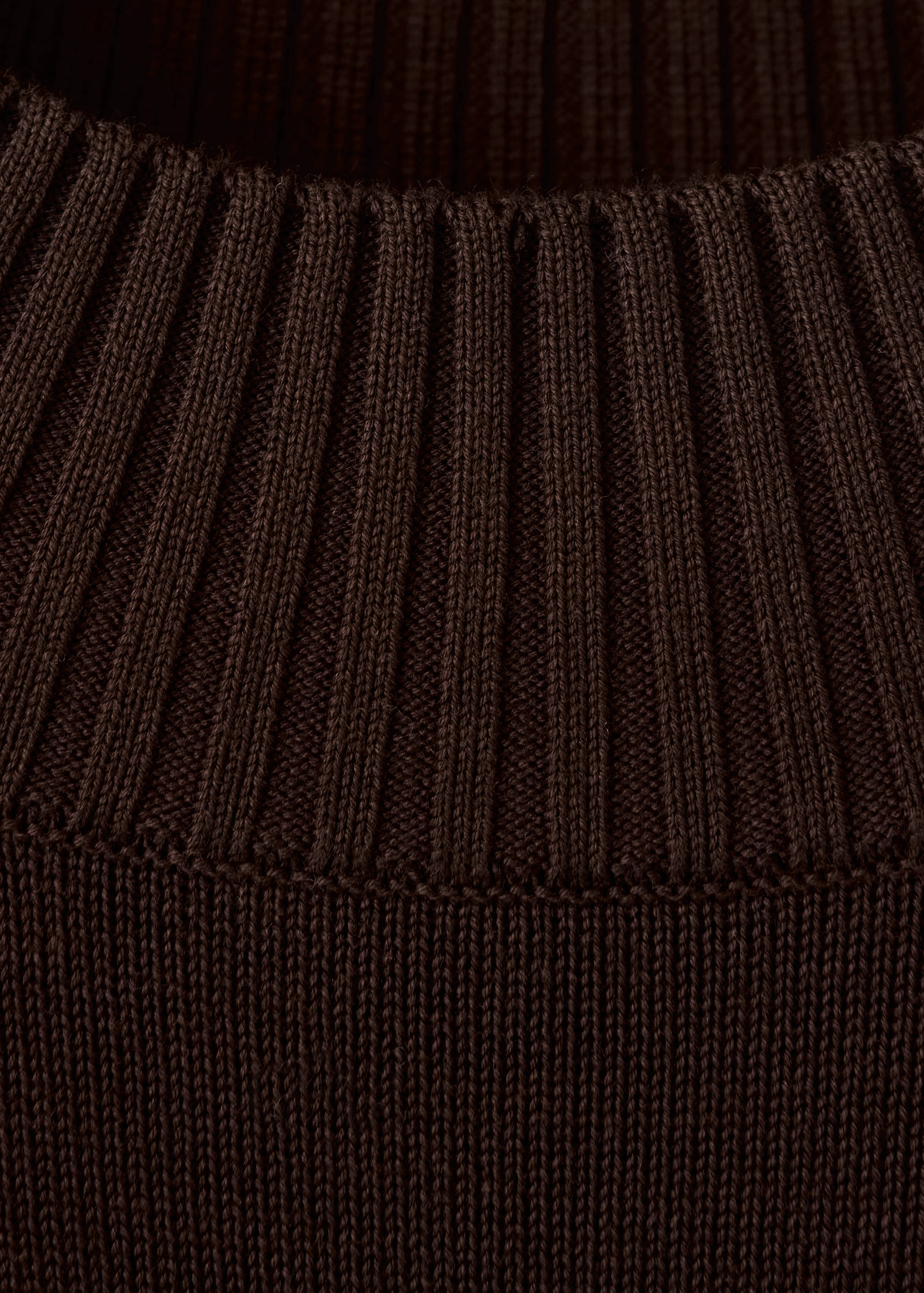 Brown men's jumper fabric detail showing ribbed knit collar.