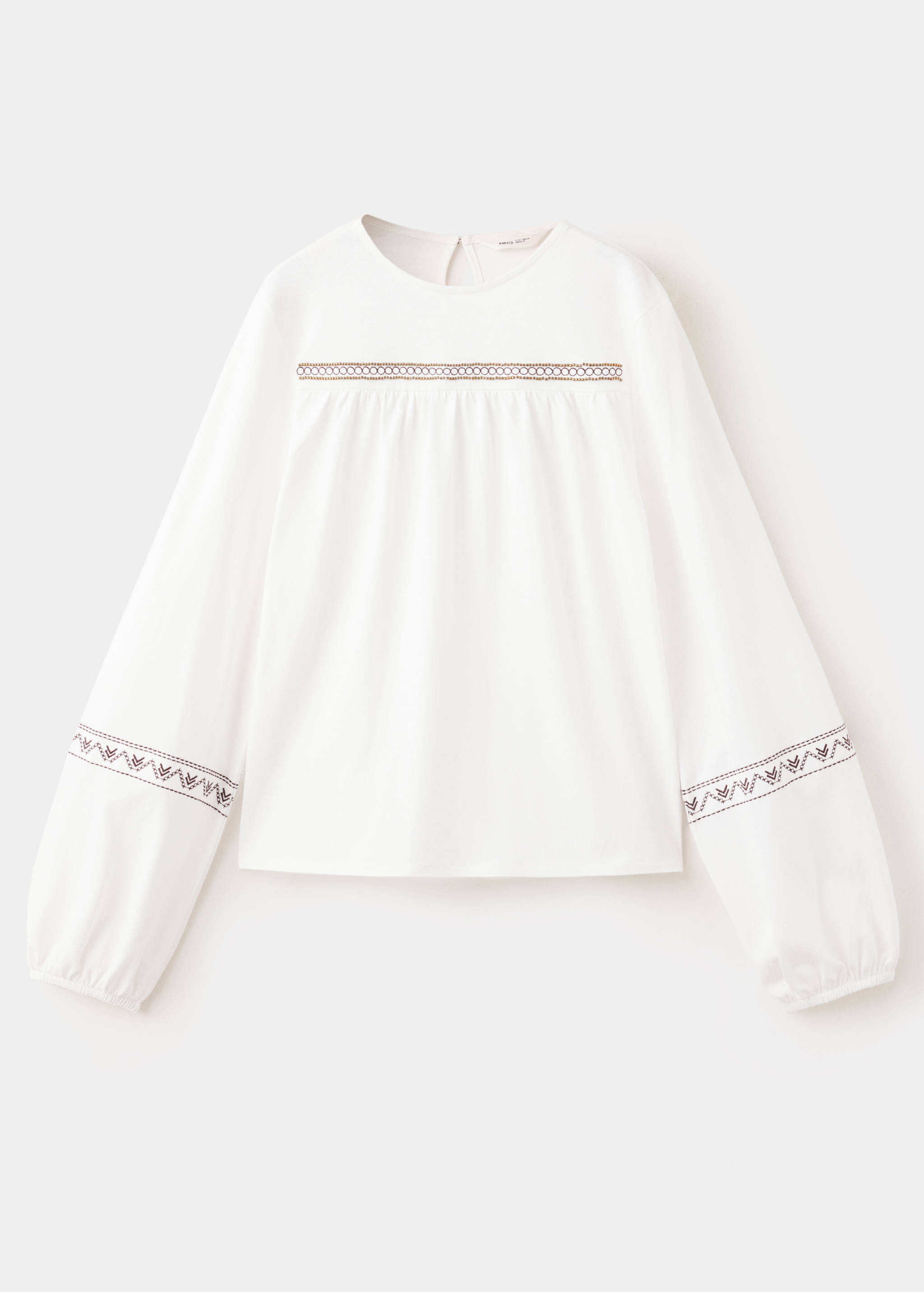 White long-sleeved T-shirt with round neck and brown embroidery details.