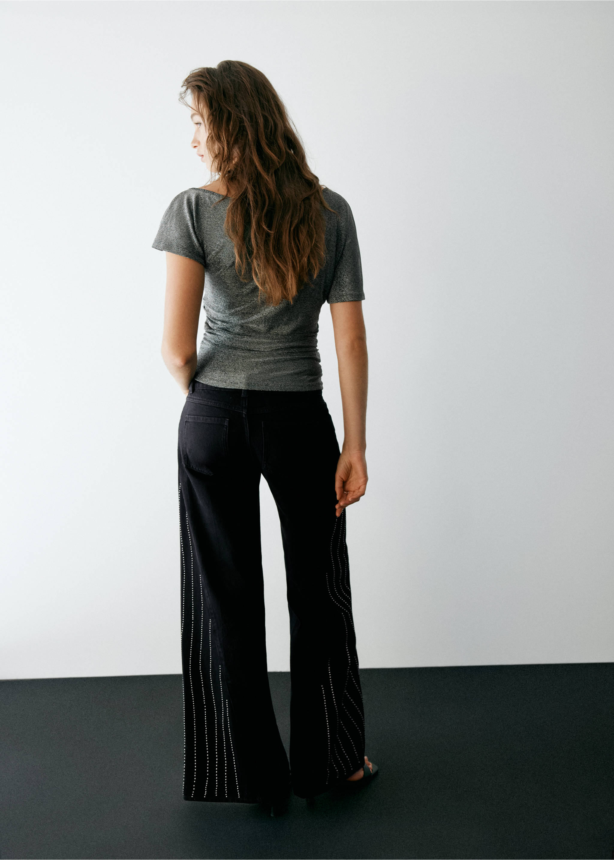 Black trousers with rhinestone side stripes, back view, Black. Ref: 37037922-00.