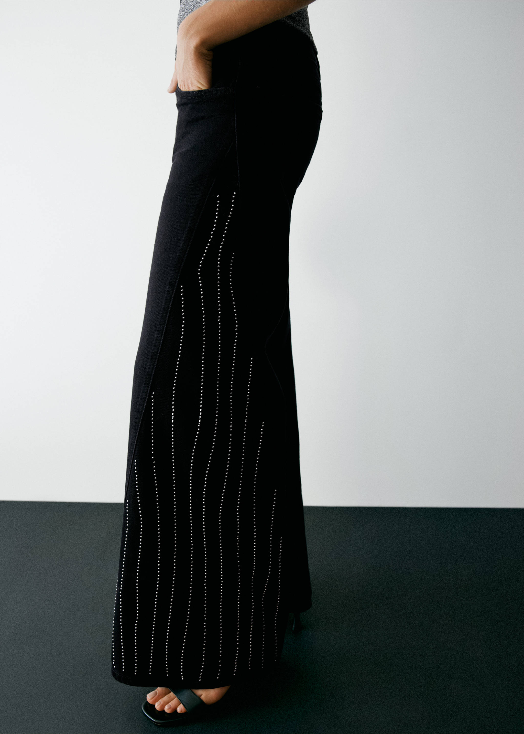 Black rhinestone-embellished denim trousers in a side view., Black. Ref: 37037922-00.
