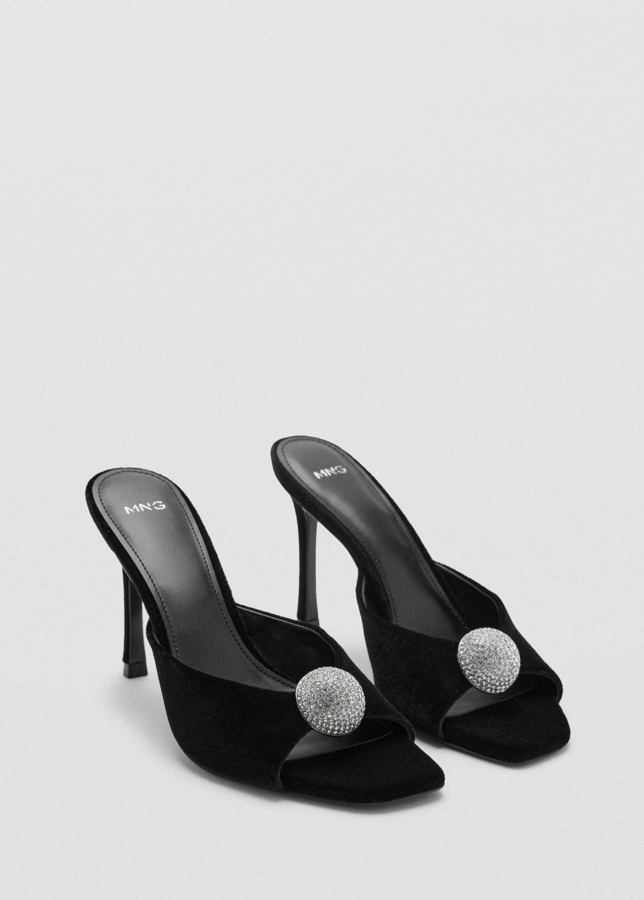 Black heeled sandals with open square toes and sparkling crystal embellishments.