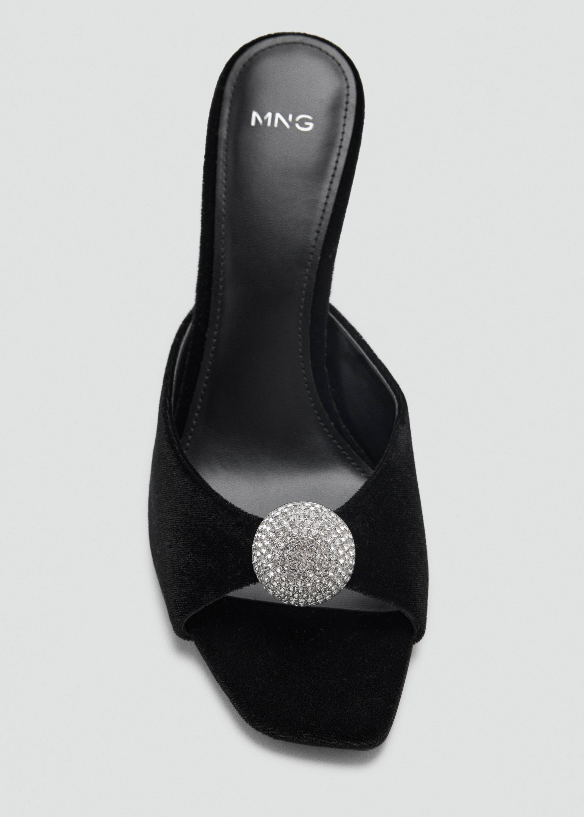 Black velvet sandal with an open square toe and a large rhinestone buckle.