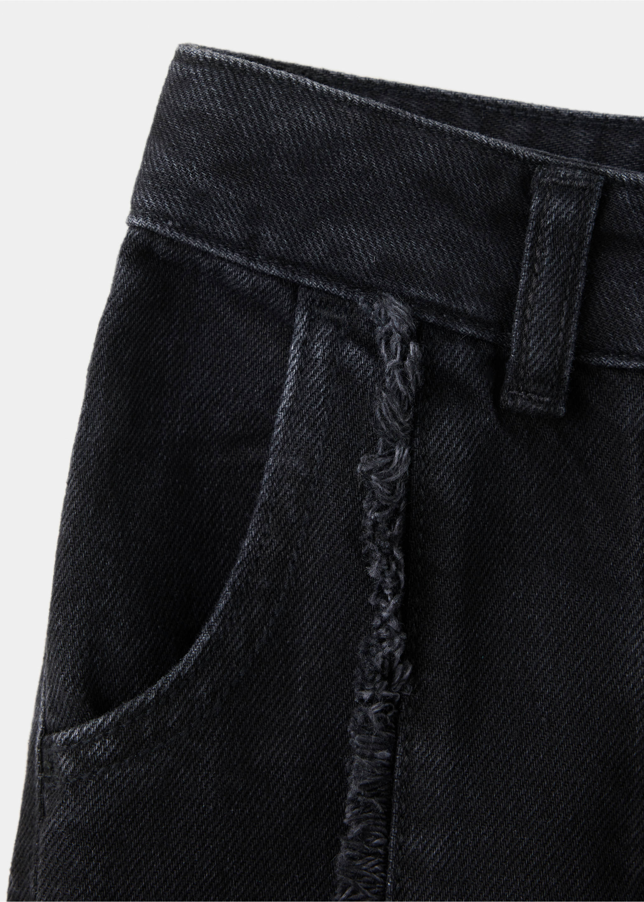 Close-up of black denim trousers featuring a structured waistband and frayed pocket detail., Black denim. Ref: 37037933-00.