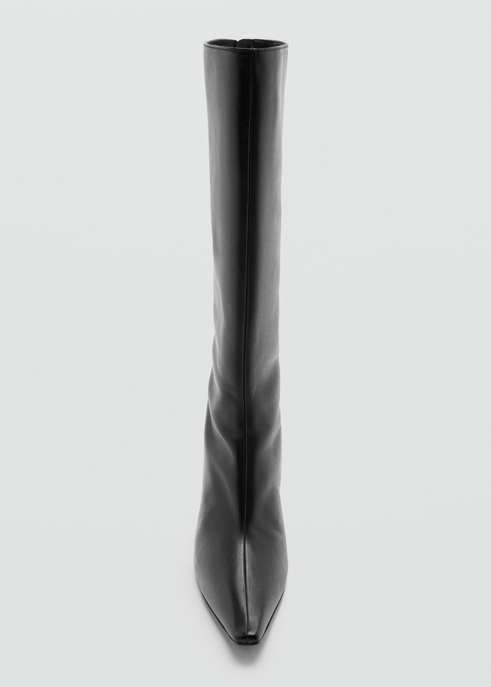 Black knee-high boot with a pointed toe.