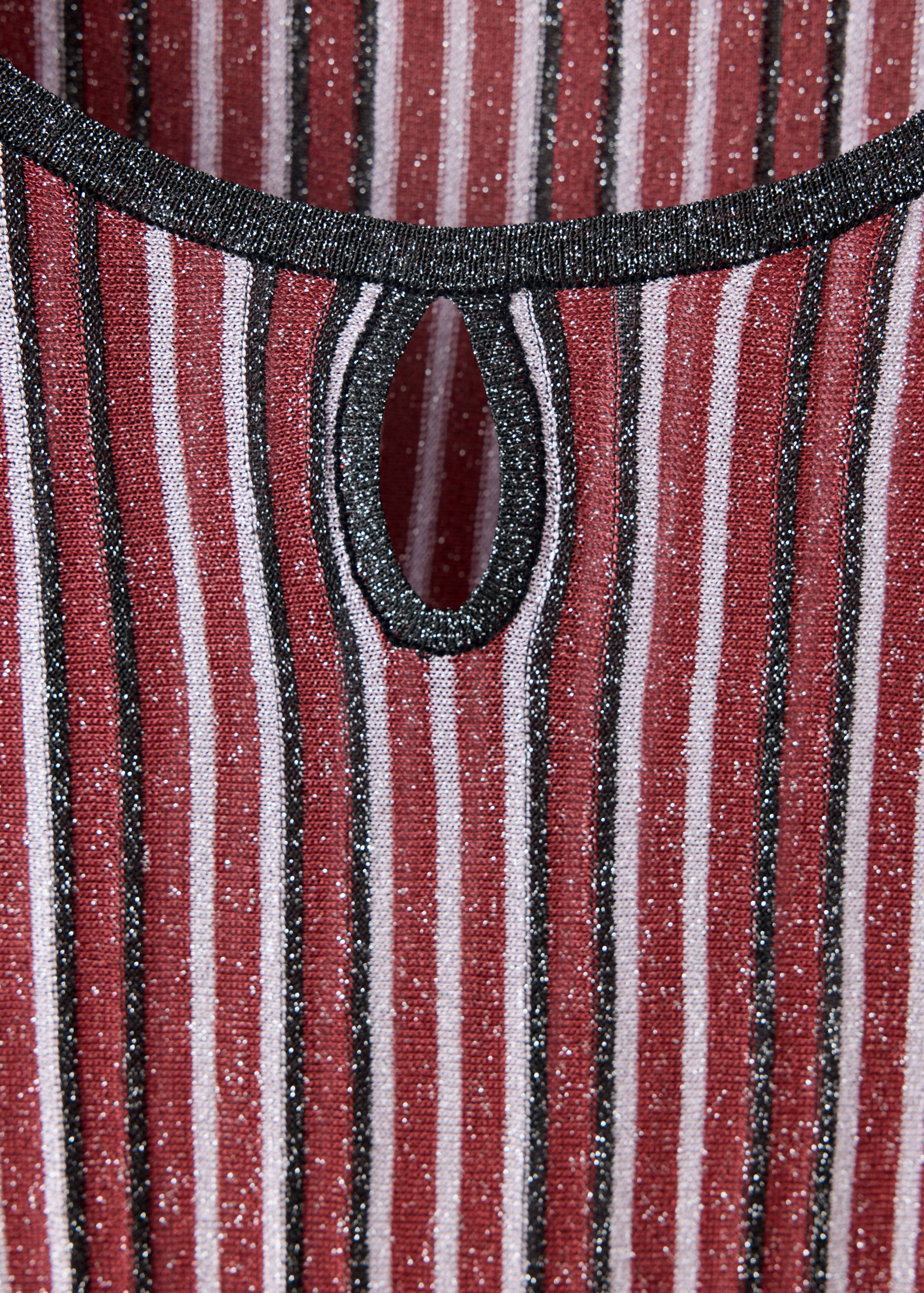 Striped metallic jersey sweater detail with keyhole cutout.