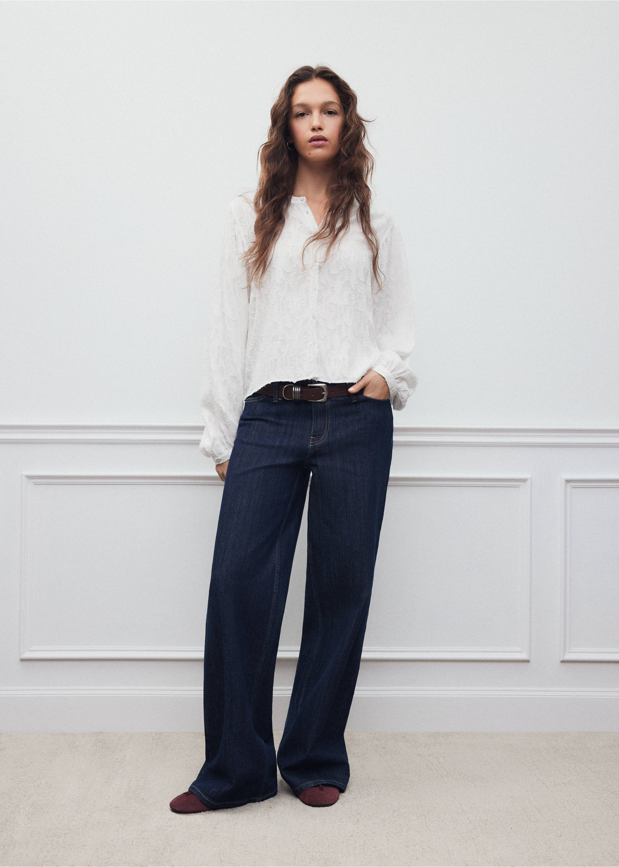 White textured long-sleeved shirt with band collar, worn with dark denim wide-leg trousers., Off White. Ref: 37038275-00.