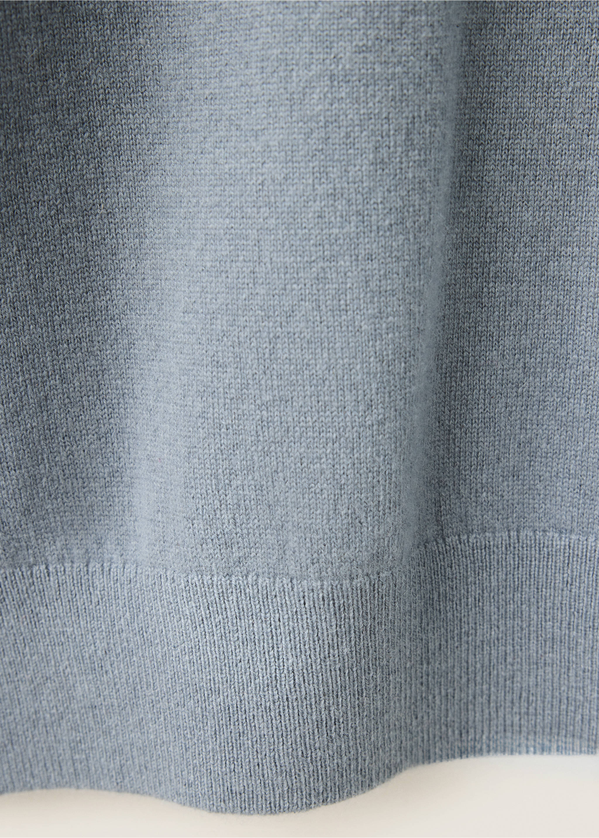 Close-up of the knit fabric and ribbed hem on a light blue jersey., Sky Blue. Ref: 37038276-00.