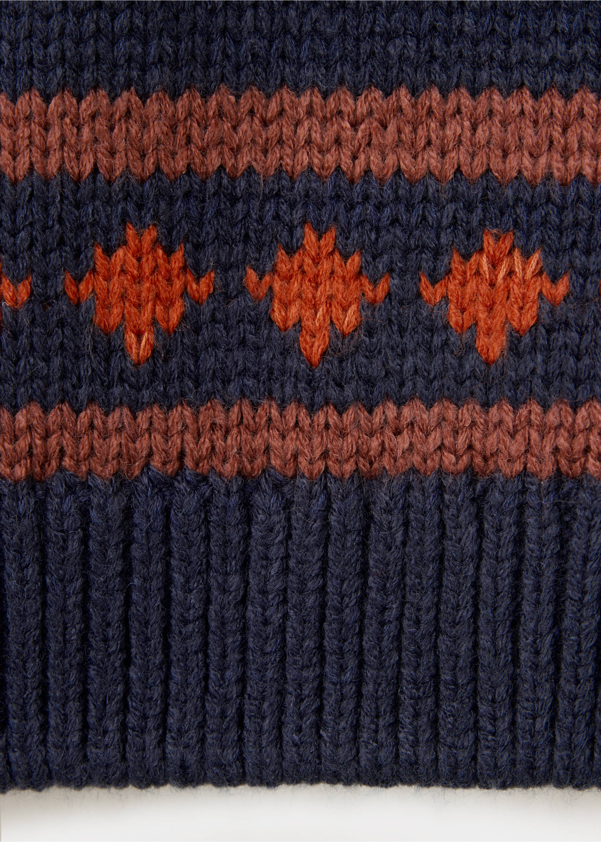 Navy blue children's jumper fabric detail with ribbed hem and orange geometric knit pattern., Navy. Ref: 37038281-00.