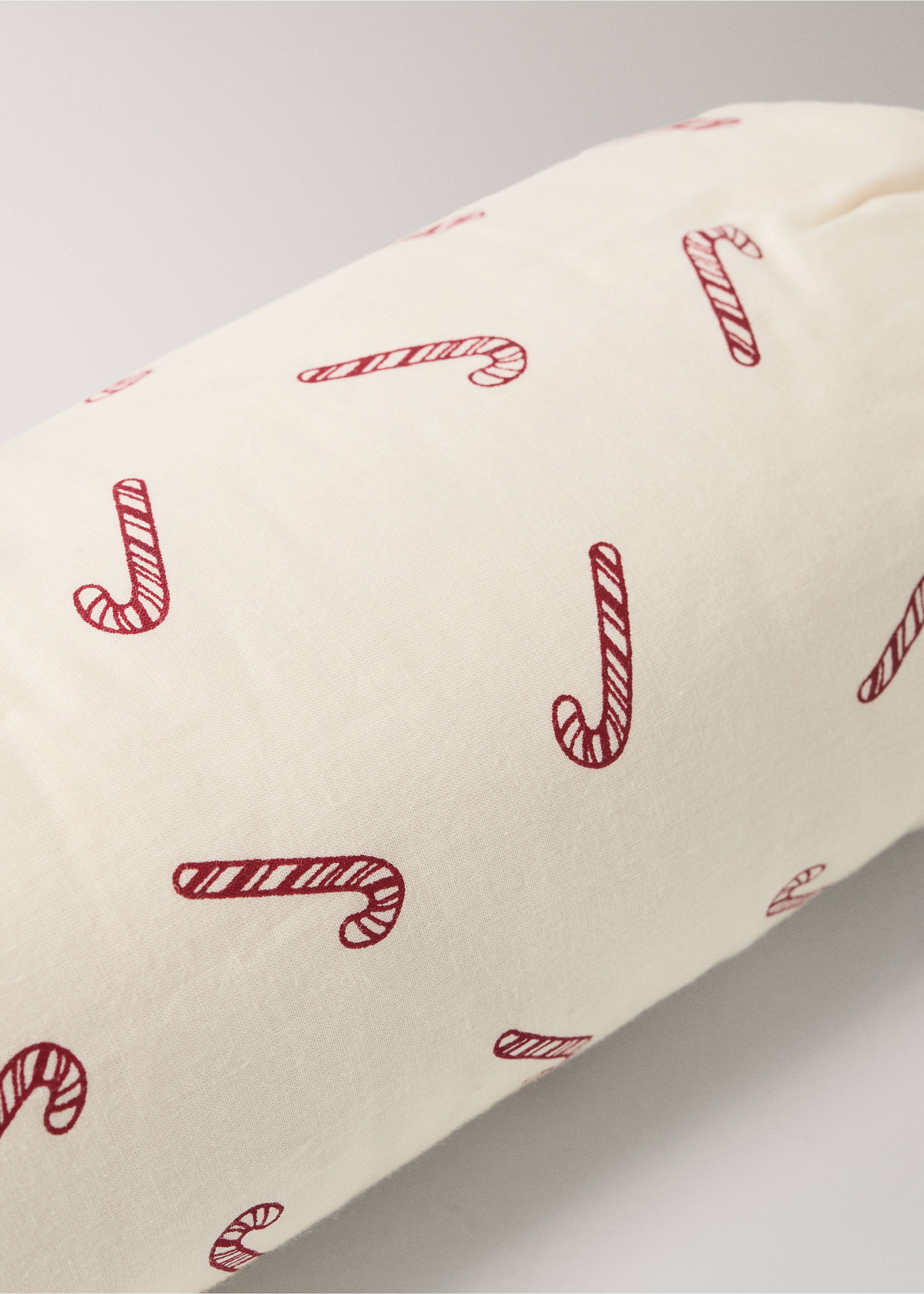 Cream cushion featuring a red candy cane print., Red. Ref: 37038636-00.