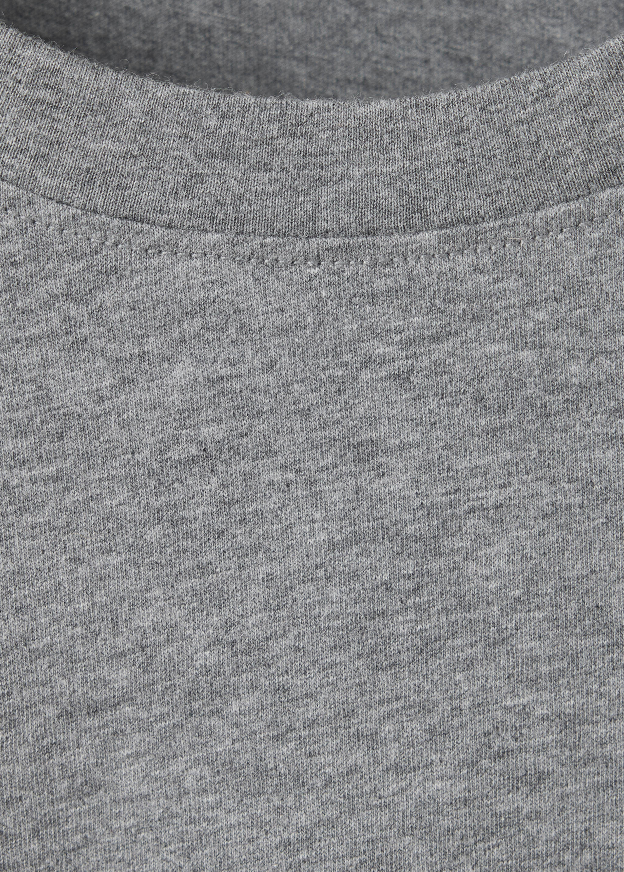 Close-up of a grey marl t-shirt's crew neckline.