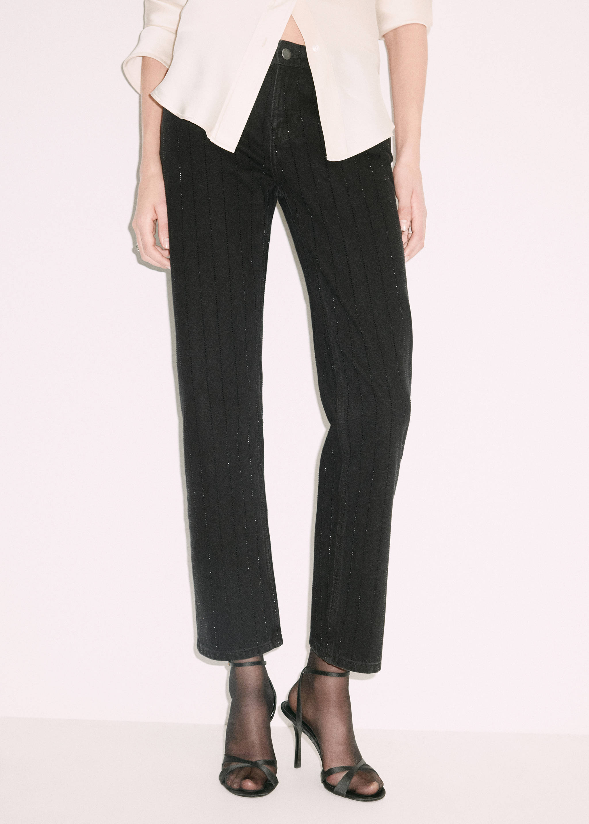 Black rhinestone-embellished straight-leg denim trousers.
