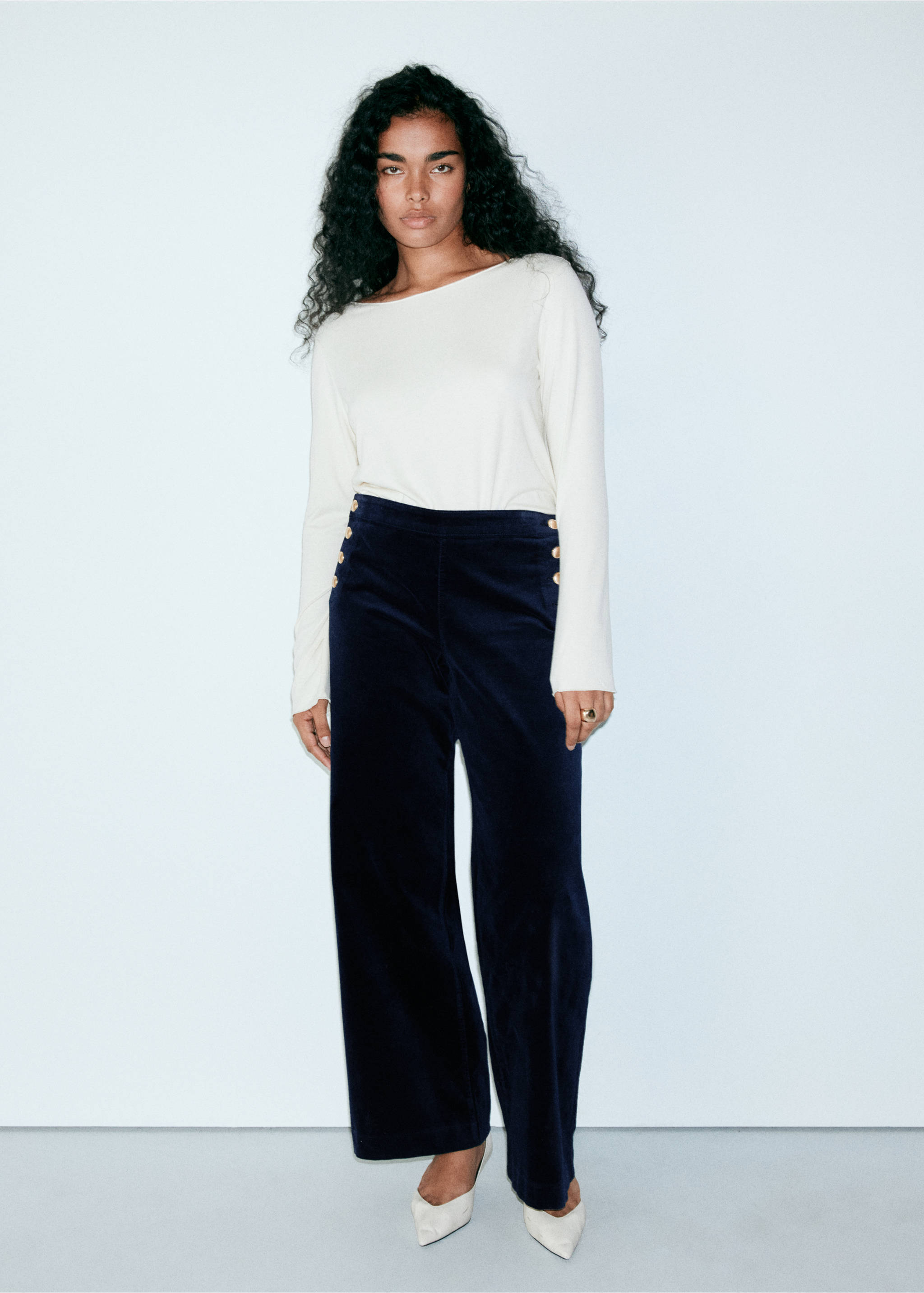 Dark navy blue wide-leg trousers with gold-toned side buttons, worn with a cream long-sleeved top., Blue. Ref: 37039117-00.