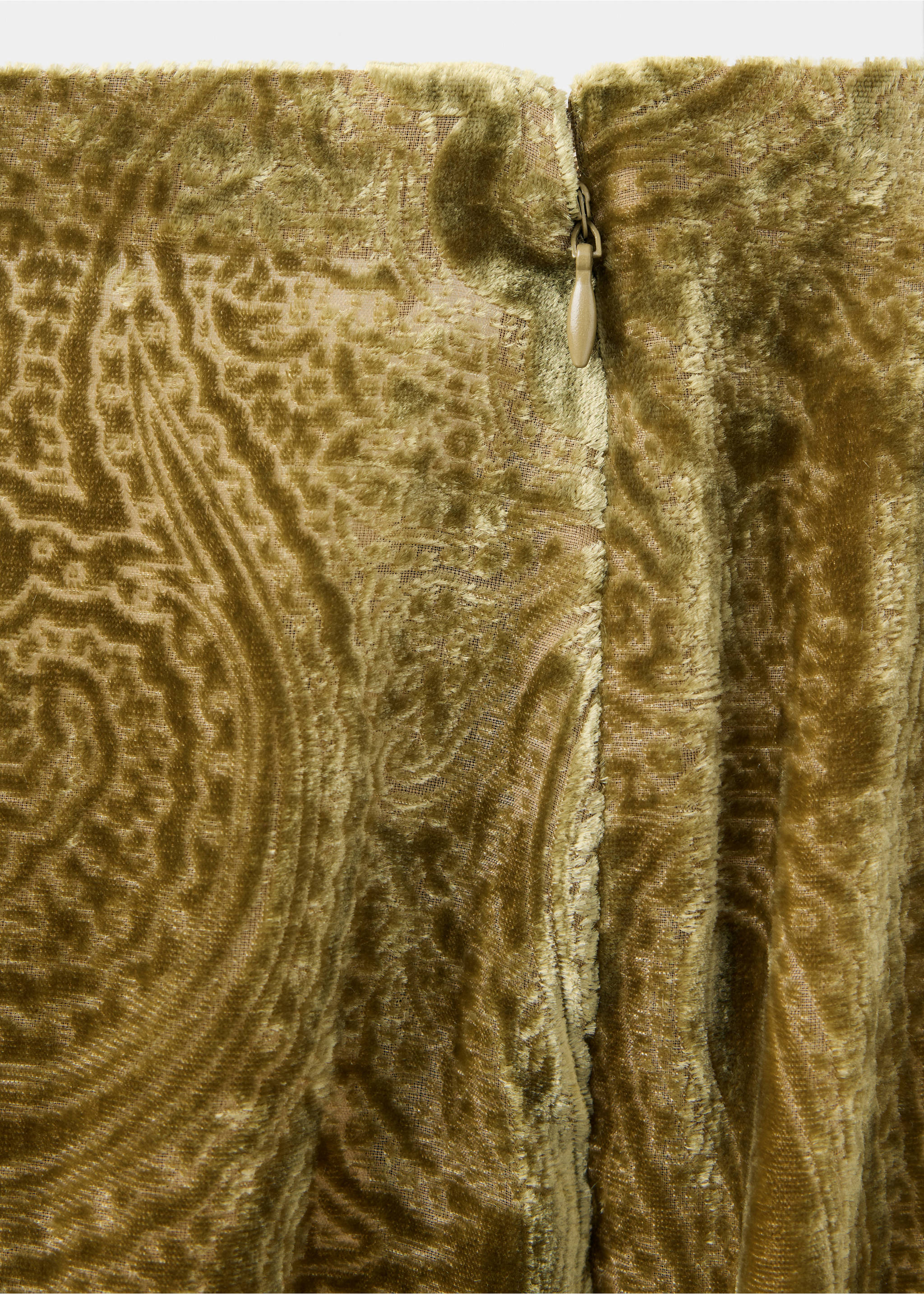 Close-up of green velvet trousers with a paisley pattern and side zip., Green. Ref: 37039129-00.