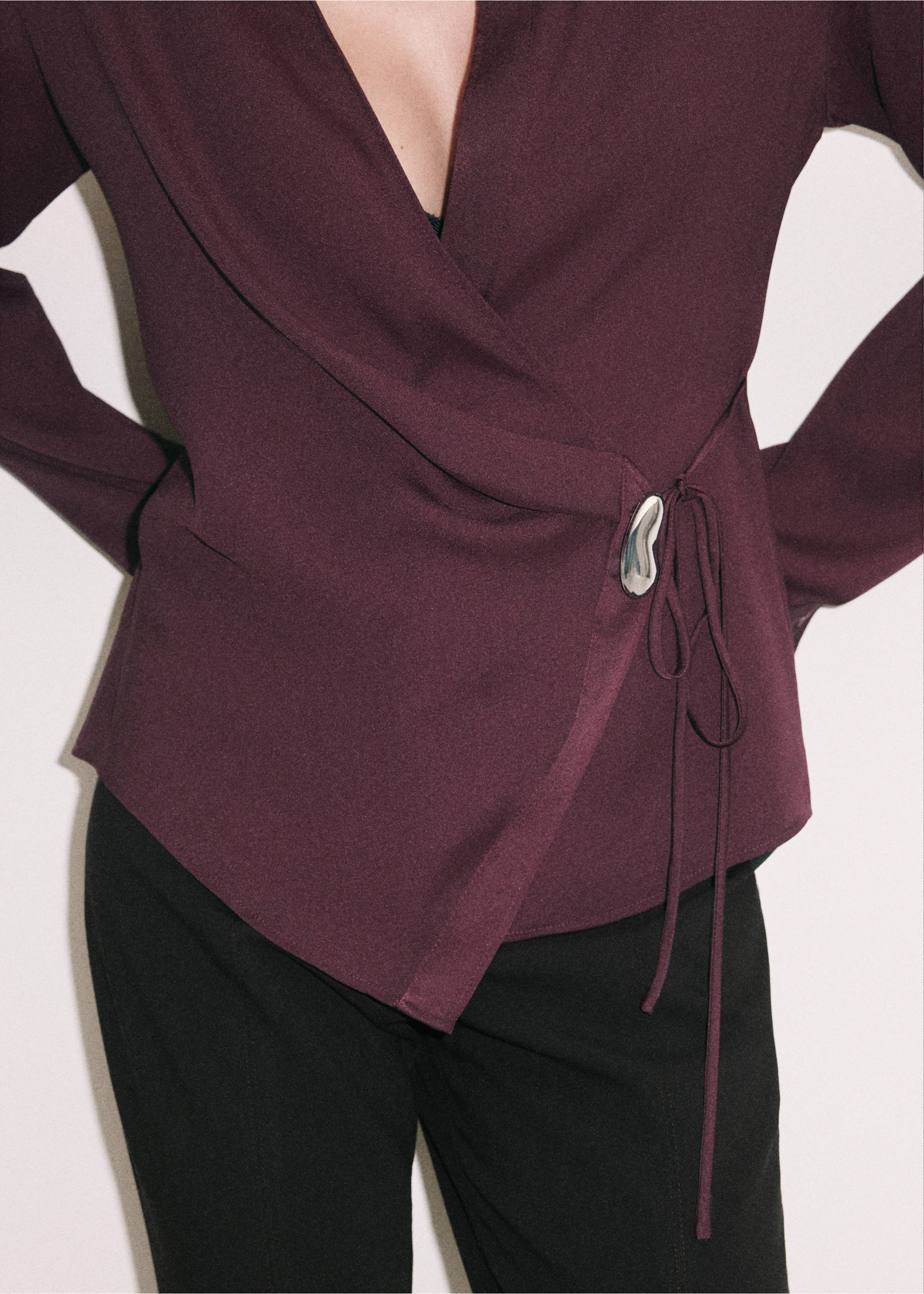 Burgundy wrap shirt with a metallic side buckle and tie closure., Burgundy. Ref: 37039130-00.