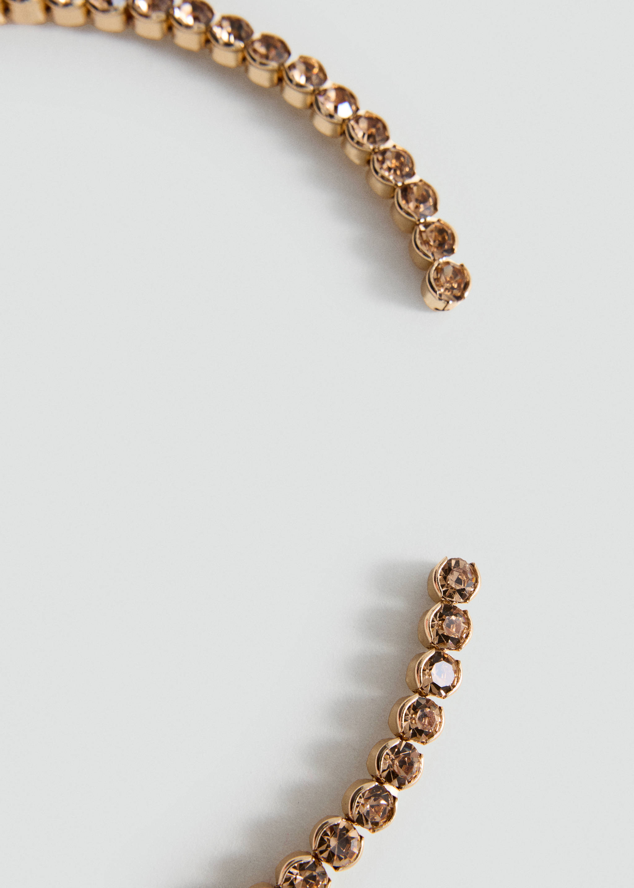 Close-up of a crystal-encrusted collar necklace.