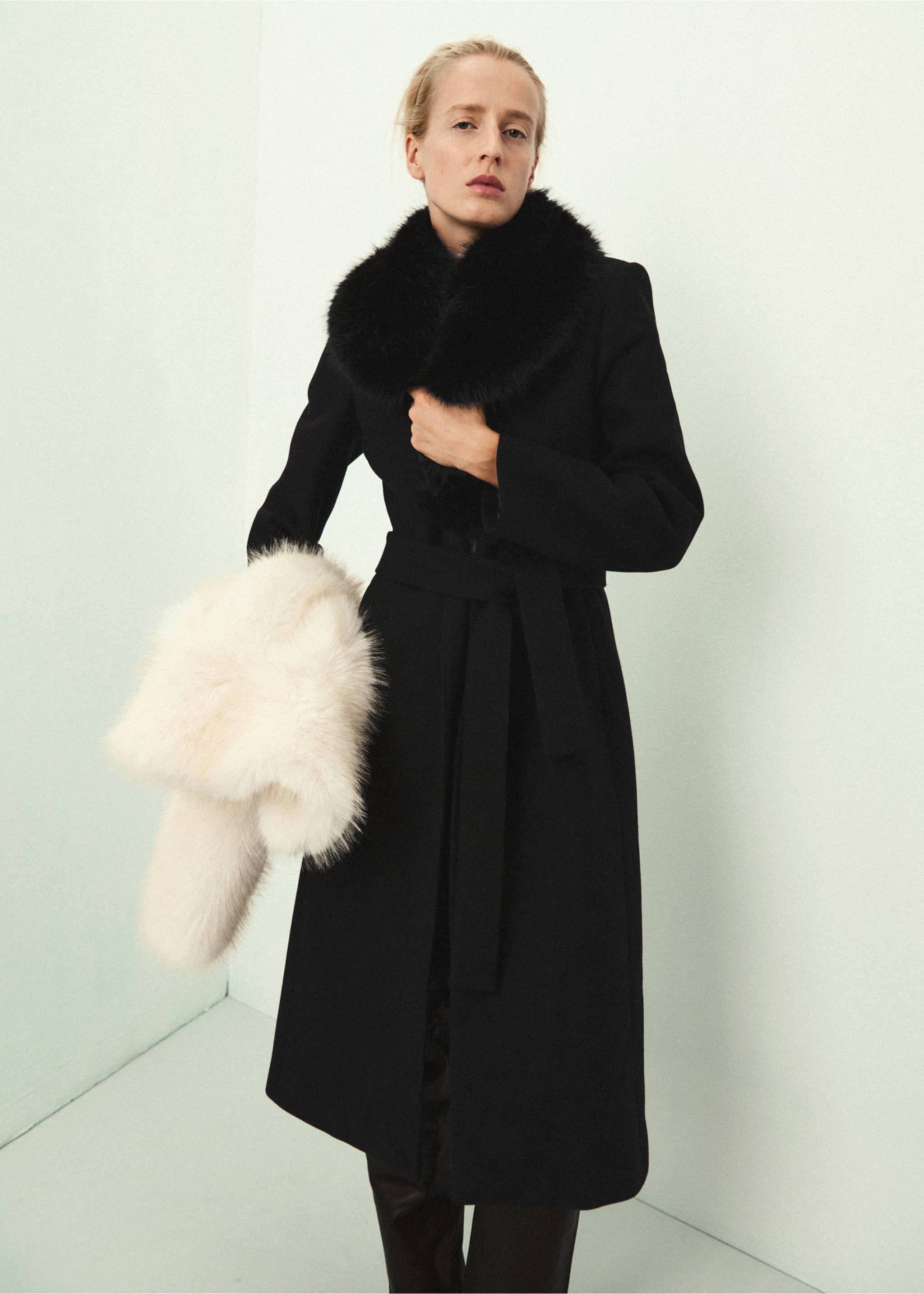 Black coat with a wide faux-fur collar and tie belt, paired with an off-white faux-fur stole., Black. Ref: 37039143-02.