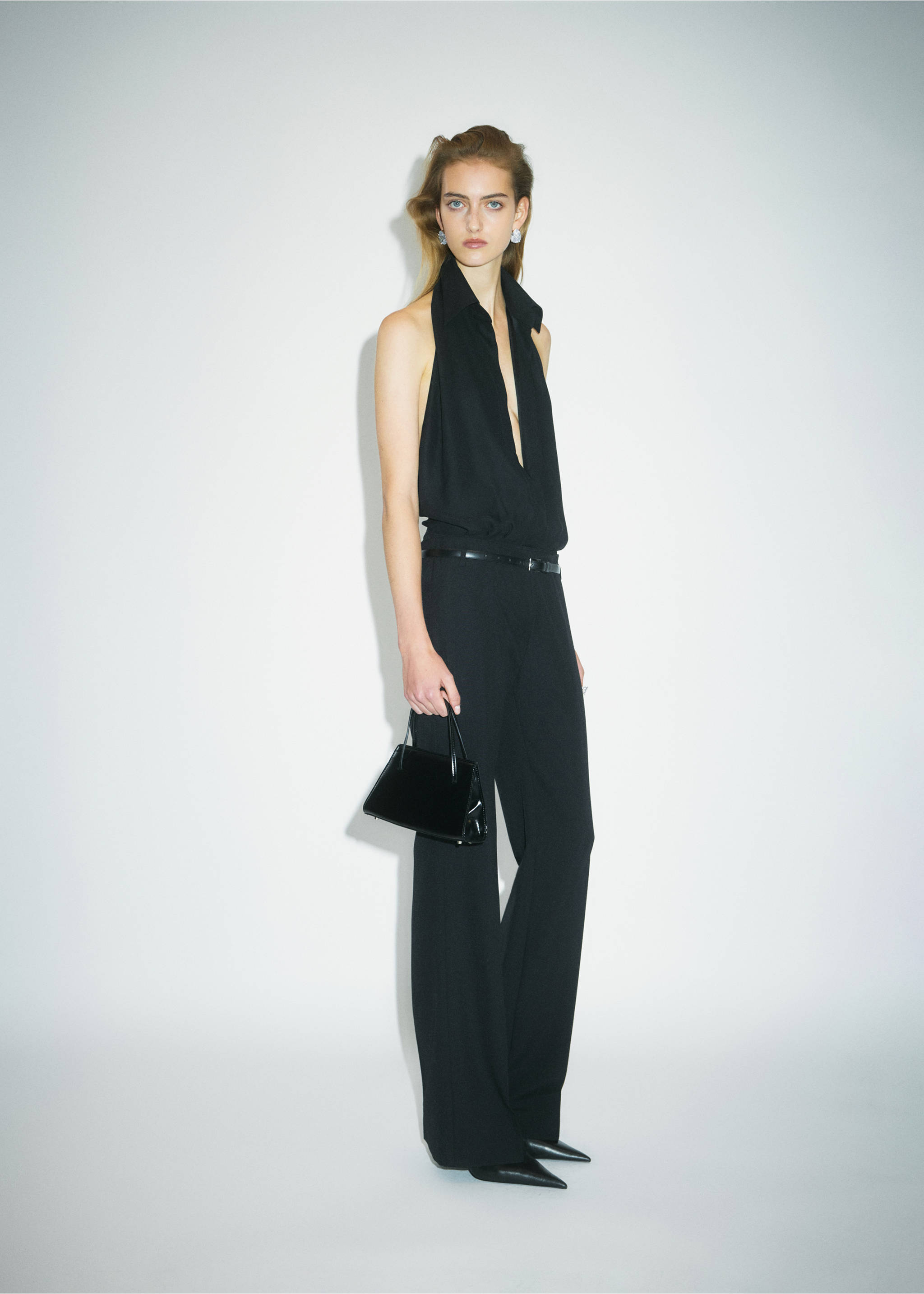 Black straight-leg trousers, worn with a matching halter top and handbag., Black. Ref: 37039145-00.