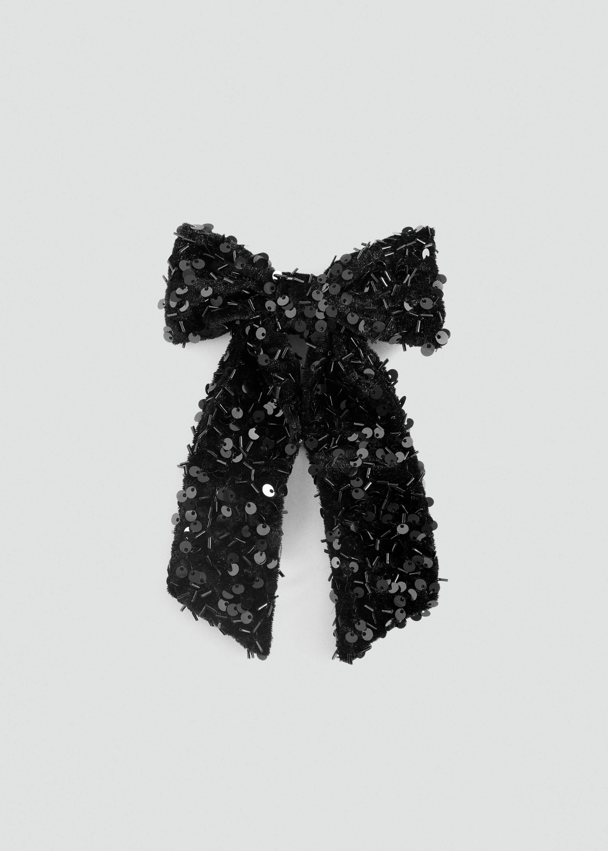 Black sequined hair bow with long tails.