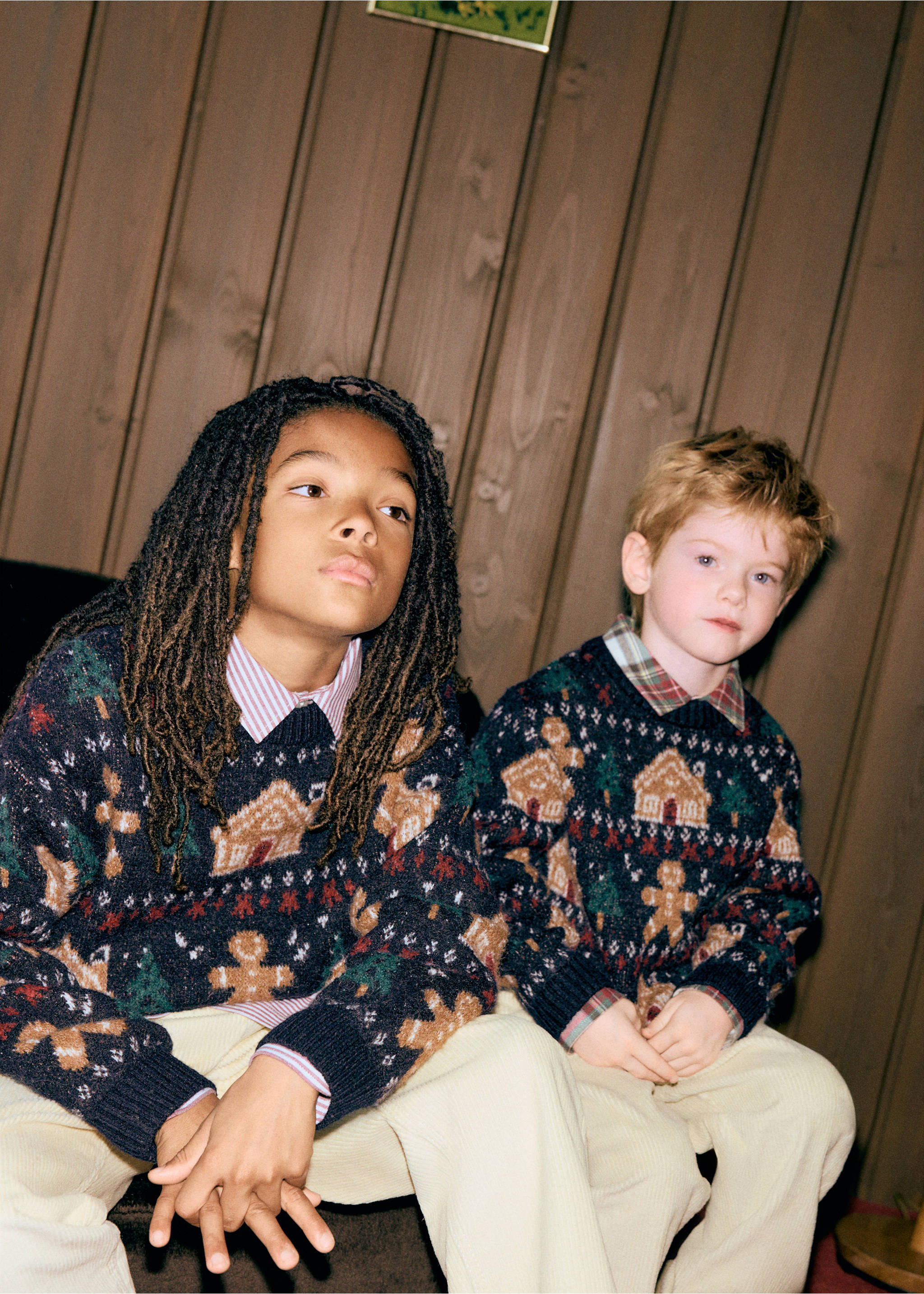 Two kids wearing festive navy blue gingerbread motif knit jumpers over collared shirts and light trousers., Navy. Ref: 37039226-00.