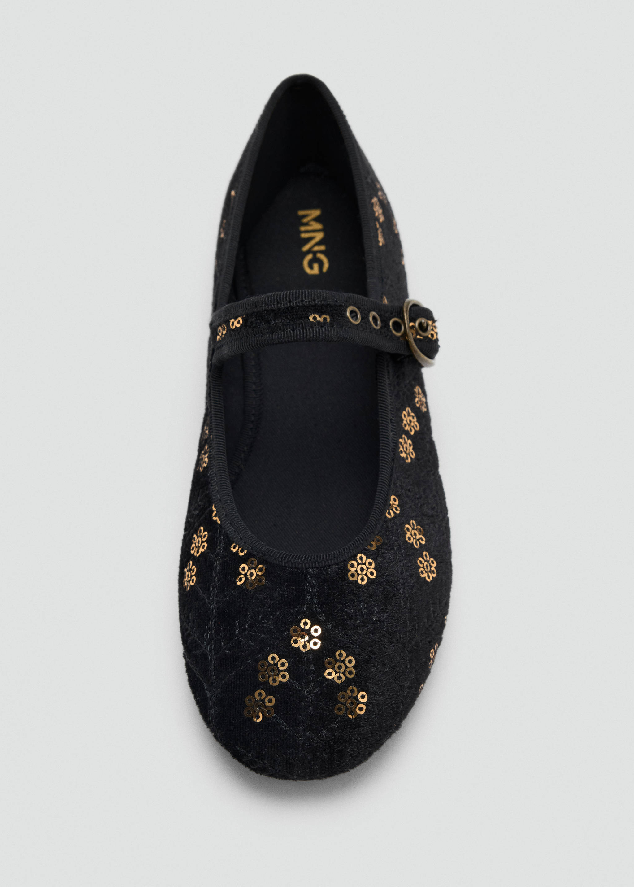 Black Mary Jane shoes with gold sequin flowers.