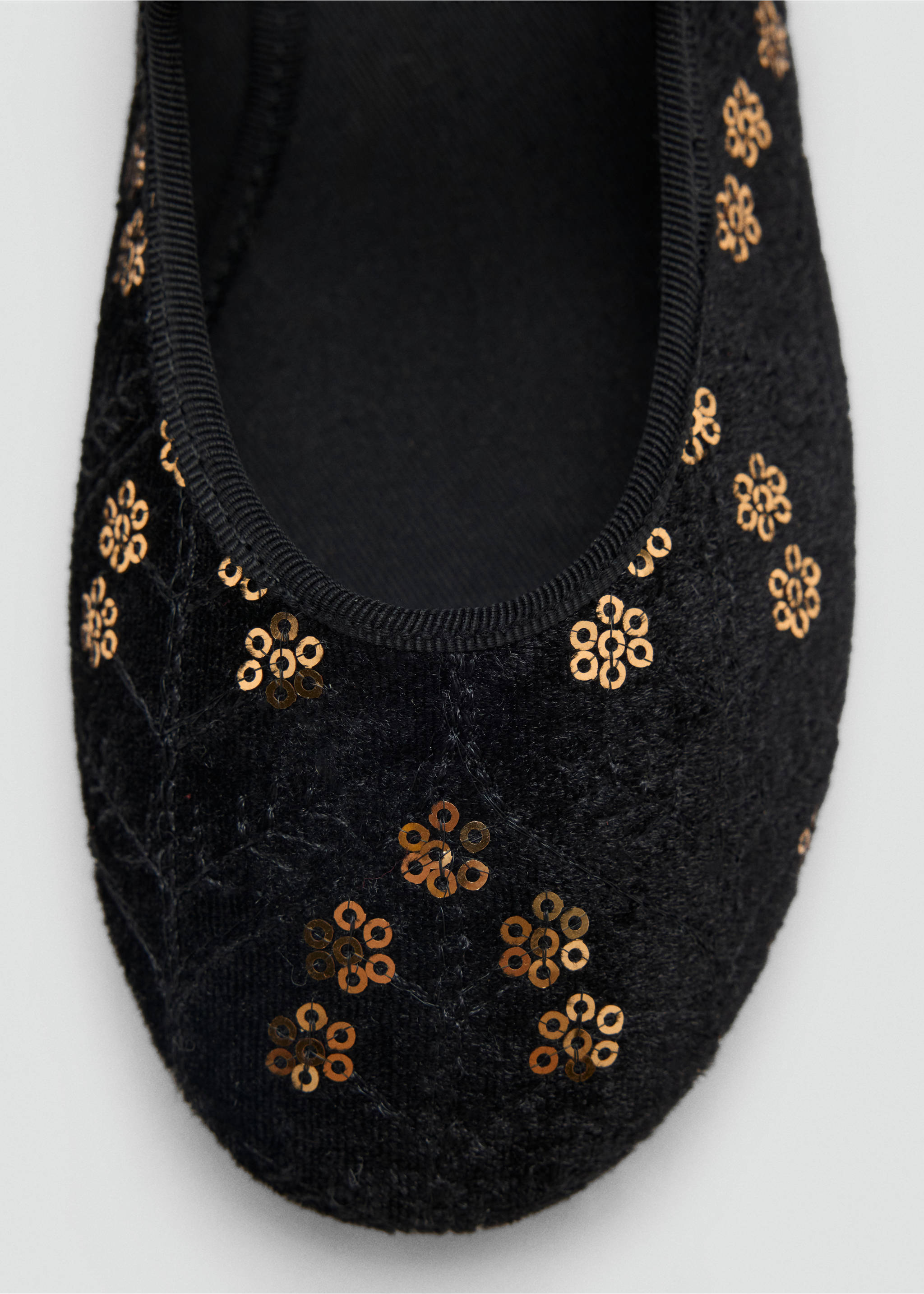 Close-up of a black shoe with gold sequin flower details and grosgrain trim., Black. Ref: 37039229-00.