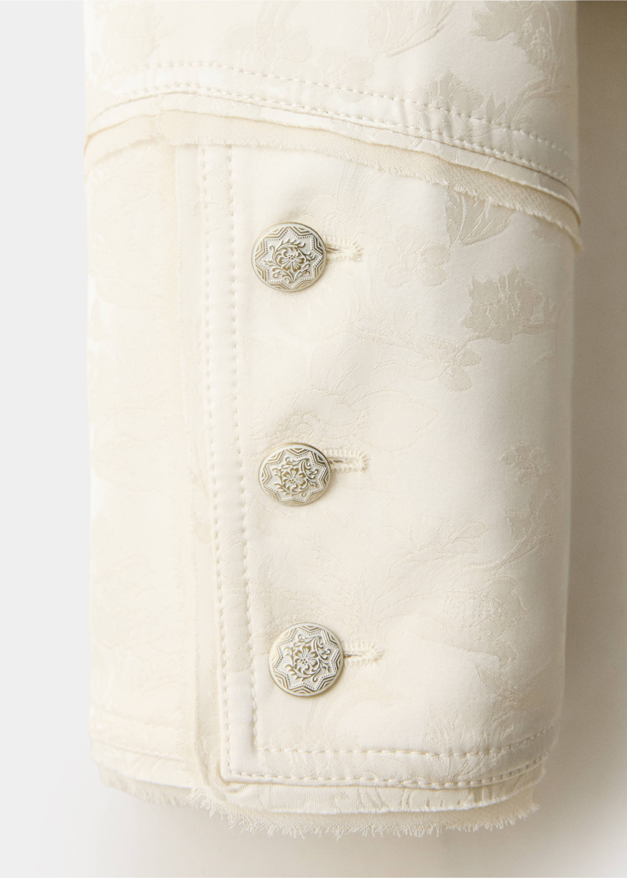 Cream jacquard jacket fabric detail with ornate metallic buttons., Ecru. Ref: 37039230-00.
