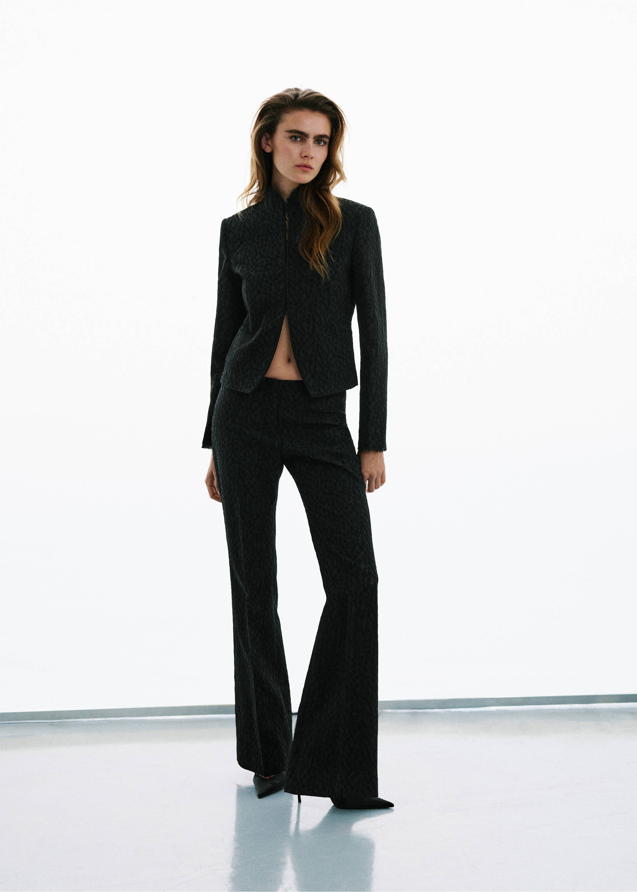Dark grey patterned trousers with a slim fit and flared hem., Black. Ref: 37039404-00.